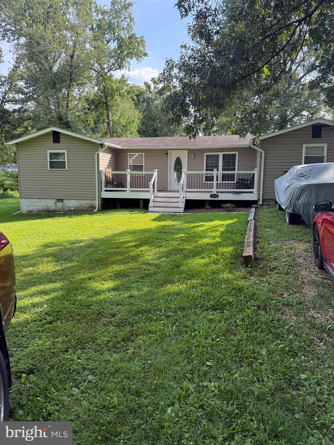 Nice U shape rambler with many recent upgrades*when you first arrive you are greated  with a  well built 24x8ft trex deck added  in 2025 that's encourage you to sit back, relax and enjoy the rest of your day * good size living room/family room leading to a galley kitchen with table space, refreshed cabinets, new stove & hood, new kitchen countertop, sink, and faucet.  The refrigerator  replaced in 2020.    New kitchen hardwood floors and remodeled  hall bath leading to three bedrooms on left side of the home.   All four bedrooms and living room has new carpet and are good size.  New hardwood floors and remodeled  hall bath leading to three bedrooms on left side of the home.  Large primary suite just off the kitchen with updated bathroom, with jetted tub and seperate shower and new vanity sink and faucet. Double french doors brings you to the  14 X 9 outside patio off the owners suite.  Nice functional front and back yard, perfect for growing family, kids playing  or adding the pool you been thinking about.   The craftsman or hobbist would be pleased with the 20 X 12 Shed with electric.   Many other big ticket items have been replaced like  roof and windows in 2012.  The entire HVAC system  with a 3 ton unit in 2020.  Gutters and downspouts in 2020.  The hot water heater, the electric panel box and water tank replaced 2003, 2015 and 2020 respectively.  Note this home is not in a subdivision !    No HOA ! So you can bring the camper, boat, jet skis or work trucks, absolutly no problem.    This property has it's own deep well  and new  double chambered septic  tank and risers just installed, so  no water or sewer bill.  The entire crawl space has been cleaned, sanitized for any mold with a new vapor barrier and reinsulated. Note this home qualifies for 100% financing with $5K lender credit to the buyer.  Welcom to do home inspection but home is sold in as is condition.