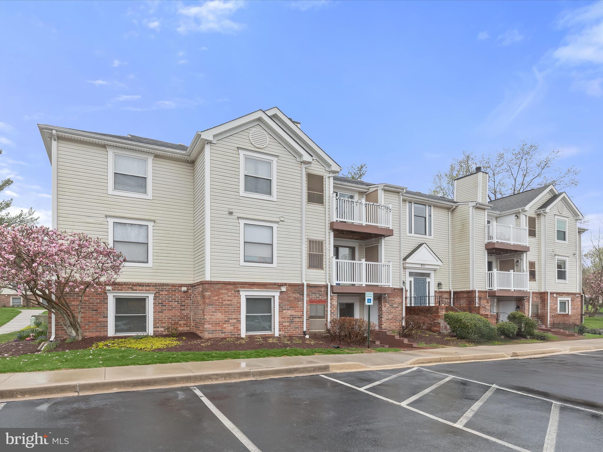 Introducing this beautifully renovated garden-level condo offering two bedrooms and two bathrooms in the sought-after Fredericktowne Village community. Designed with accessibility in mind, this thoughtfully laid-out unit provides both a main building entrance and a level private entry through the patio, enhanced by a wide hallway that allows for easy navigation inside. Freshly painted interiors welcome an abundance of natural light, highlighting the open-concept design and luxury vinyl plank flooring. The spacious living room opens to the ground-level patio through sliding glass doors with built-in blinds, creating an inviting indoor-outdoor connection. The dining area is accented by a modern three-pendant light fixture and a convenient breakfast bar for casual meals or entertaining. The updated kitchen features granite countertops, stainless steel appliances, a pantry, and a brick backsplash sourced from a historic South Market Street row home—adding a touch of Frederick’s charm and history. Retreat to the primary bedroom, complete with a walk-in closet outfitted with an organizing system and a private ensuite bathroom boasting a tiled walk-in shower with sliding glass doors. The second bedroom, also enhanced with a closet organizing system, offers flexibility as a guest room, home office, or cozy lounge. A second full bathroom with a tub/shower and a laundry closet with full-sized stacked washer and dryer complete this home. Step outside to the patio fitted with a roll-down privacy shade and two outdoor storage closets. A reserved parking space (801A) sits just outside the unit beside the handicap spot and ramp to the patio, with ample guest parking available throughout the community. Recent upgrades include new paint, bedroom carpeting, and oven (2025); washer, pantry addition, and recessed lighting over the breakfast bar (2024); along with window replacements and a primary bathroom update (2022). Enjoy access to community tot lots and nearby Riverwalk Park across the street, featuring walking trails, a baseball diamond and softball field, disc golf course, roller rink, pavilion with picnic tables, and playgrounds. Additional nearby outdoor amenities include Uptown Dog Park, pickleball and basketball courts, and more. Conveniently located with quick access to Route 15, I-70, I-270, Route 26, Route 340, and the MARC Train—all within minutes. Everyday essentials, local dining, and entertainment abound, with five grocery stores nearby and easy access to the Frederick Fairgrounds, Baker Park, Carroll Creek, and Historic Downtown Frederick. Some images have been virtually staged.