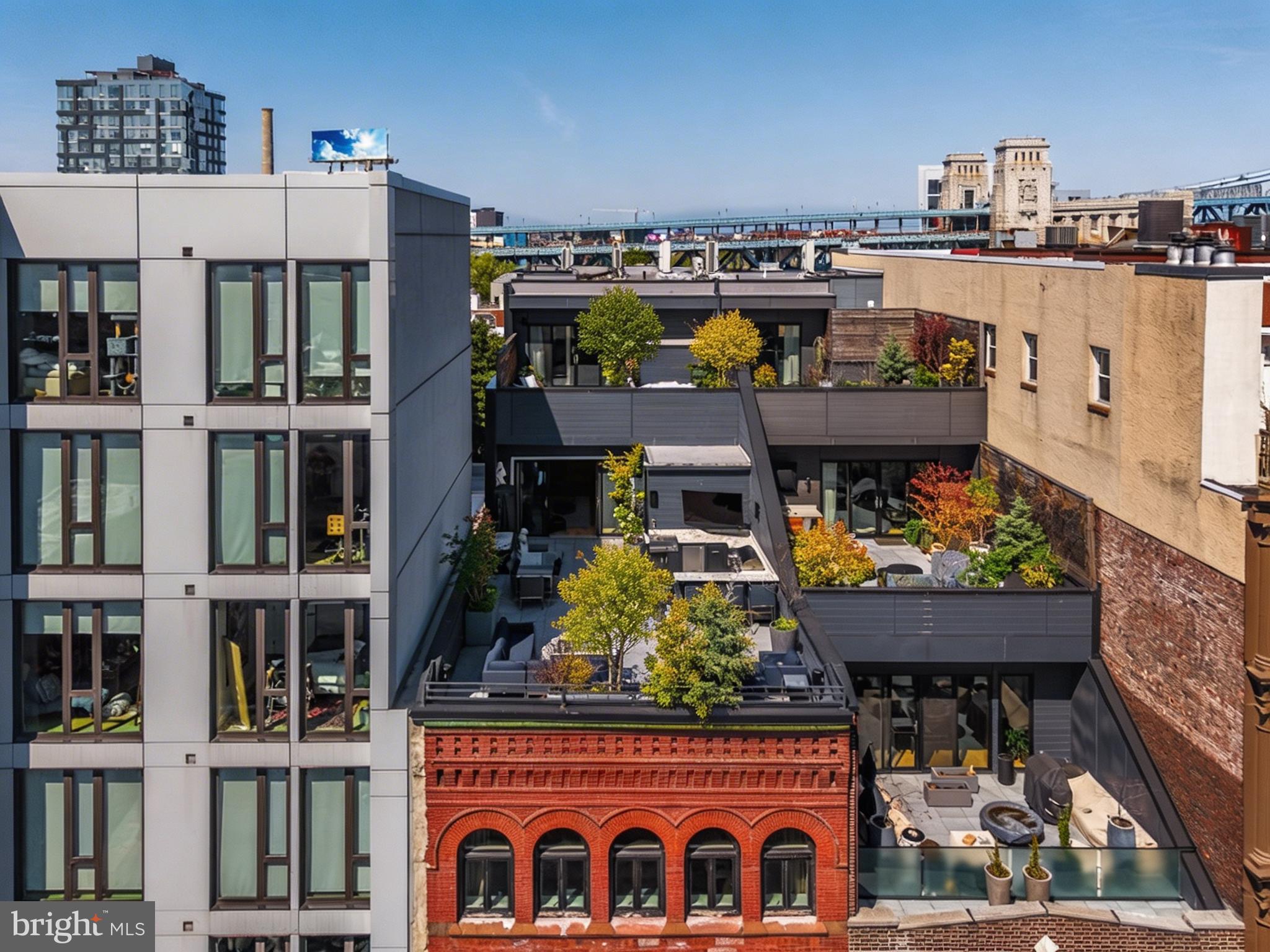 Penthouse 2 at 115 Arch Street, Old City’s iconic condominium. Set atop two historic turn-of-the-century industrial buildings, this trophy duplex encompasses 3,556 interior square feet complemented by two private terraces totaling 1,267 exterior square feet.The bright and airy living area opens directly onto a terrace overlooking Arch Street, offering expansive southern views of the city skyline. At the heart of the home, the kitchen is a masterclass in design by Idea Group and Record e Cucine. It features custom cabinetry and a professional-grade suite of Wolf and Sub-Zero appliances, including a built-in coffee system, wine preservation, and a high-performance range. A custom white oak staircase leads to the second level, where the primary bedroom offers total privacy, completely separated from the rest of the floor. This primary suite serves as a true retreat, outfitted with two generously sized Pianca walk-in closet systems, its own large private terrace, and an en-suite five-fixture bathroom finished with radiant heat flooring and a deep soaking tub and SPA jet. Across the floor, two rear bedrooms offer ample closet space and framed views of the Benjamin Franklin.
115 Arch Street is a premier conversion of two adjacent industrial buildings. In a testament to technological innovation, the property is equipped with a virtual intercom system for remote access. Owners enjoy private automated indoor parking accessed through the rear of the building. For added convenience, cold storage is available in the building lobby. This residence offers the significant advantage of a 7-year tax abatement. Deeded parking on the first floor with a rear garage entry and licensed storage room in the basement. Please note that a second deeded parking space is available at an additional cost off site.
