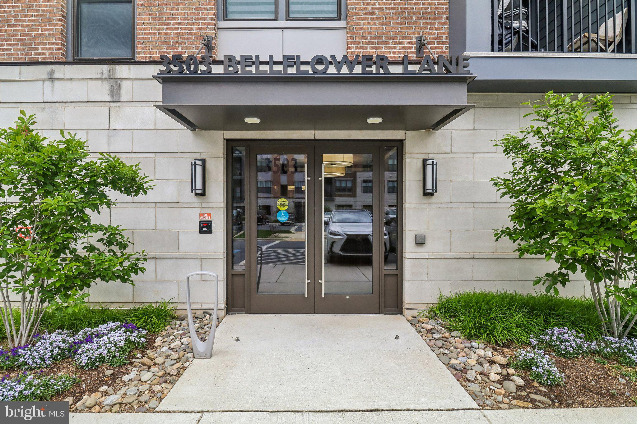 Welcome to The Finn model at The Flats at Tower Oaks: A top-floor, 2‑bedroom, 2‑bath condo with a den/home office and over 1,500 sq. ft. of modern, open‑concept living. The spacious layout features a gourmet kitchen with a 10‑ft quartz island, premium stainless‑steel appliances, and a gas range, opening seamlessly into a bright living and dining area with large picture windows and hardwood flooring. A glass‑paneled door leads to the private den/home office. The western‑facing balcony overlooks a lush tree line, offering beautiful views and stunning sunsets. The owner’s suite includes an oversized walk‑in closet and a spa‑inspired en‑suite bathroom with dual sinks and a frameless glass shower. There is also a second large bedroom and a full bath. Plus, a laundry room with a full-size washer and dryer and cabinetry. This unit is in a secure building with a reserved garage parking space with easy access to EV charging stations. Residents enjoy exclusive access to The CORE, the community’s resort‑style center featuring an outdoor pool, café, fitness and yoga studios, and inviting outdoor lounges with fire pits. It is also a short walk across the street to Clyde’s and scenic neighborhood parks.  The Preserve at Tower Oaks offers unmatched convenience with quick access to Rockville, Bethesda, Northern Virginia, Pike & Rose, Park Potomac, and major commuter routes, including I‑270.
