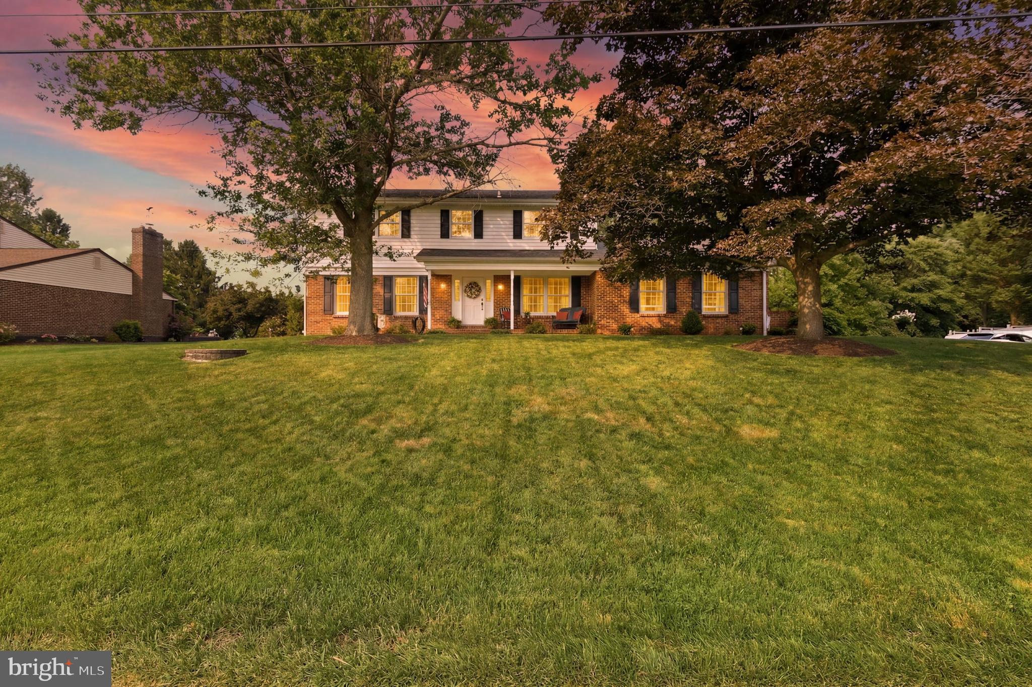 Welcome to timeless elegance! This is the home that you have been waiting for!  Situated on a beautifully landscaped .56-acre lot, this meticulously maintained 4-bedroom, 2.5-bath colonial seamlessly blends classic charm with thoughtful modern updates. From the moment you arrive, you'll be pleasantly surprised by the stately brick-front exterior, mature shade trees, and welcoming covered front porch. Step inside to discover a home filled with warmth and quality craftsmanship, featuring rich hardwood floors, crown molding, spacious living areas, and an inviting floor plan designed for everyday living!

The heart of the home is the beautifully renovated kitchen, complete with crisp white Kemper cabinetry, quartz countertops, subway tile backsplash, stainless steel appliances, a farmhouse sink with a Weymouth faucet, a Fisher and Paykel stove, recessed lighting, and a large center island—perfect for gathering with family and friends.

Just beyond the kitchen, escape to the spectacular four-season sunroom. Walls of windows, French doors, a stunning coffered ceiling, and slate tile flooring create a light-filled retreat you'll enjoy year-round while overlooking the expansive backyard.

The inviting family room offers timeless character with exposed wood beams, custom built-in bookcases, and a beautiful brick fireplace, creating the perfect setting for relaxing evenings at home.

Upstairs, you'll find four generously sized bedrooms. Step into each room to discover its own personal design. The primary bedroom is sure to please with an upgraded private bath. 

The finished lower level provides exceptional additional living space ideal for a media room, game room, fitness area, home office, or playroom, while still offering ample storage.

Outside,  the oversized lot provides the perfect combination of privacy and open space for entertaining, gardening, outdoor recreation, or simply enjoying the peaceful surroundings.

Lovingly maintained and beautifully updated throughout, this move-in-ready home offers the perfect balance of timeless architecture, modern amenities, and exceptional indoor and outdoor living. Opportunities like this are rare—schedule your private tour today!