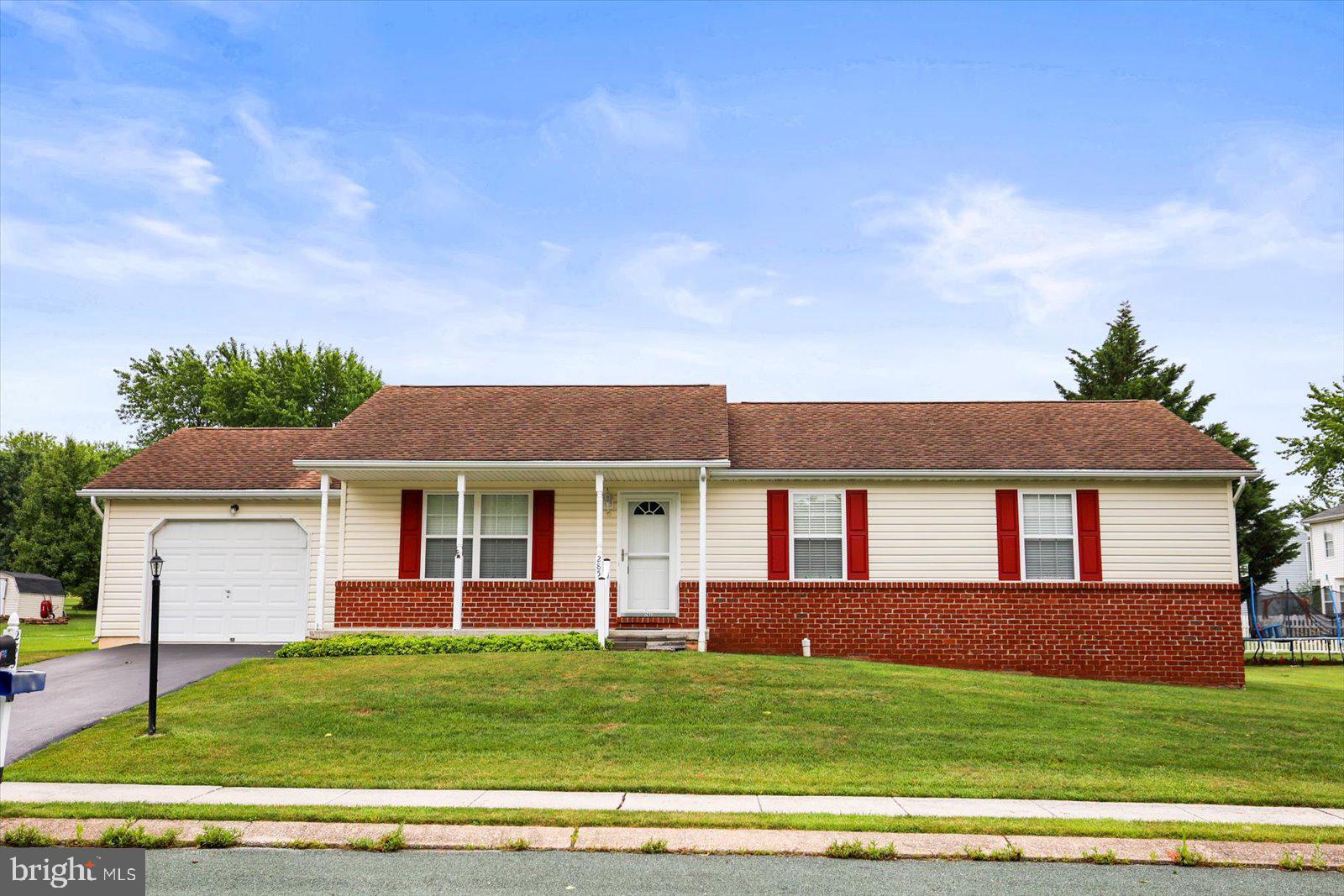 Welcome home to this well-maintained 3-bedroom, 2-bath ranch offering approximately 1,300 square feet of comfortable one-level living. With timeless curb appeal, a welcoming front porch, and an attached garage, this home is ready for its next owner.

Step inside to a spacious living room featuring a cozy gas fireplace, creating the perfect place to relax or gather with family and friends. The open layout flows seamlessly into the bright eat-in kitchen and dining area, complete with abundant cabinetry, generous counter space, and sliding glass doors that lead to the rear deck.

Enjoy your morning coffee or evening cookouts on the deck overlooking the level backyard—ideal for entertaining, gardening, or simply enjoying the outdoors.

The home offers three comfortable bedrooms, including a primary suite with a private full bath, while a second full bathroom provides convenience for family and guests.

Need more space? The full basement offers endless possibilities for storage, a workshop, home gym, or future finished living area. An attached one-car garage and paved driveway provide additional storage and off-street parking.

Whether you're a first-time buyer, looking to downsize, or searching for easy one-floor living, this home offers comfort, functionality, and room to grow.

This inviting ranch combines classic charm with everyday convenience—don't miss your opportunity to make it yours!