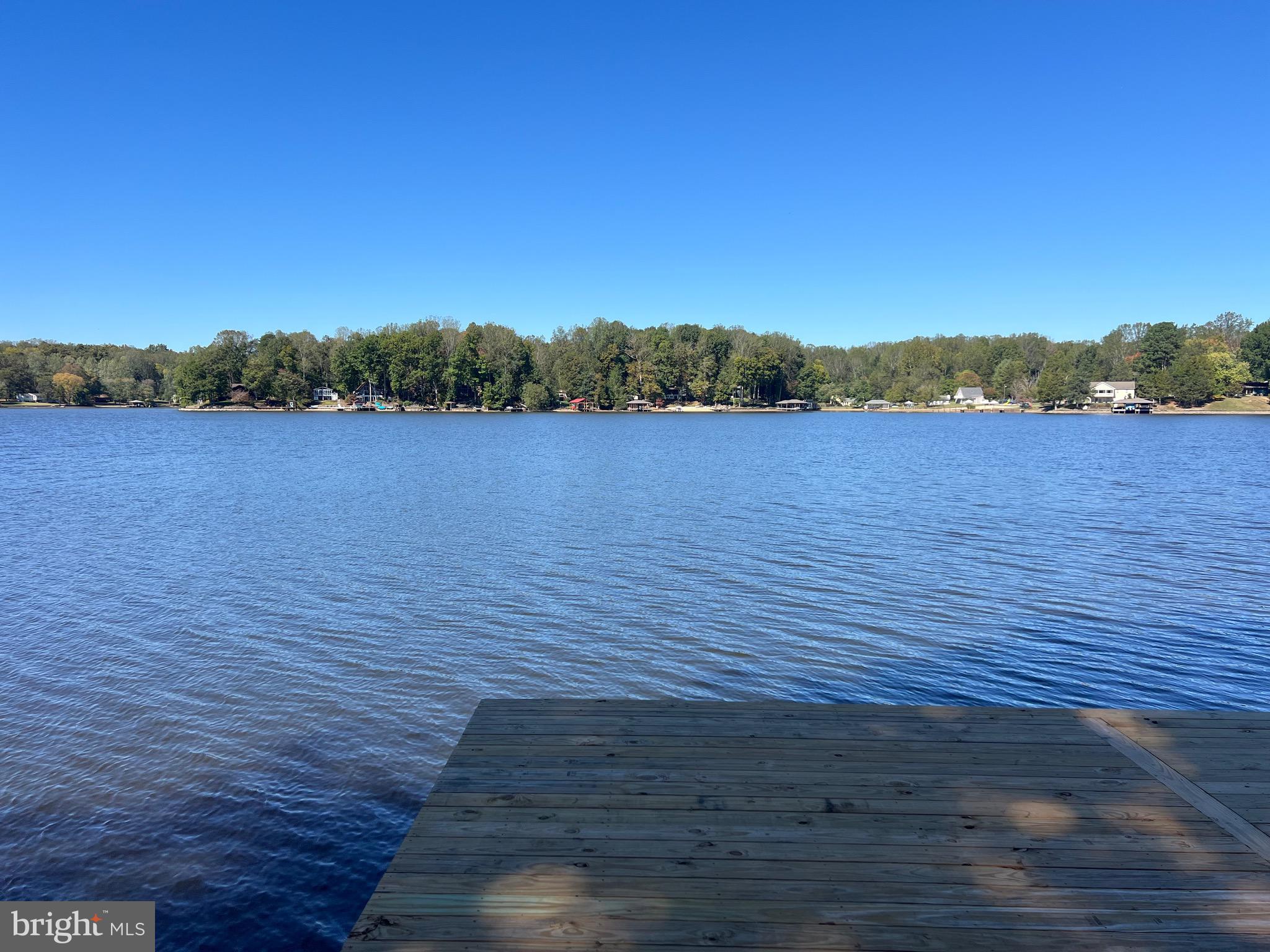 WATER FRONT LOT ON LAKE LOUISA. BUILD YOUR DREAM HOME & ENJOY THE RESORT LIVING COMMUNITY OF BLUE RIDGE SHORES. NEW DOCK &  BULK HEAD JUST FINISHED. 55 FEET OF WATER FRONT WITH PANORAMIC VIEWS OF THE LAKE!. LOT CURRENTLY HAS OLD HOME ON THE LOT.  SELLER IS WILLING TO REMOVE HOME AT SELLERS EXPENSE WITH ACCEPTABLE OFFER. SELLER ALSO HAS DRAIN FIELD PAPERWORK AND WILL PASS IT ON TO THE NEW OWNER. CALL LISTER WITH QUESTIONS.