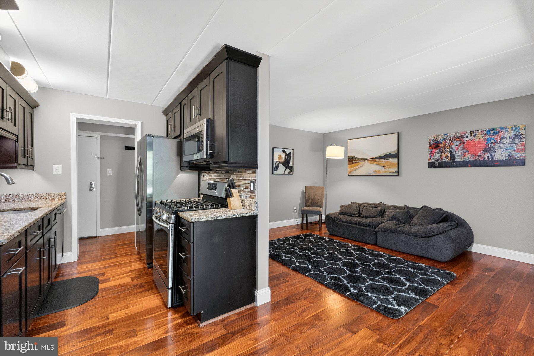New Price! Same amazing home, even better value! The Reston, VA Lifestyle You've Been Seeking! New Price! Same amazing home, even better value! Welcome to 2330 Freetown Court #4/1B, a stellar and move-in ready 2 bedroom and 1 full bath condominium nestled within the desirable Glenvale community in the heart of Reston, offering the perfect balance of comfort, convenience, outdoor recreation, and access to one of Northern Virginia's most sought-after lifestyles. Freshly painted throughout in 2026 prior to market, this inviting residence showcases bright, light-filled living spaces, a functional open layout, and attractive hardwood flooring that extends throughout the kitchen, living room, hallway, and bedrooms, creating a warm and cohesive appeal. Large windows bring in abundant natural light while framing views of the surrounding mature trees and landscaped grounds. The spacious living room with access to the rear patio and community open space with a playground, benches and walking trail creates an ideal setting for both everyday living and entertaining, while the well-designed kitchen offers ample cabinetry, generous workspace, granite countertops and durable hardwood flooring that blends beauty and functionality. The sizable primary suite provides a peaceful retreat, and the flexible floorplan with a second bedroom offers options for guests, a home office, or fitness space. The bathroom is thoughtfully appointed with ceramic tile flooring and separate granite-topped vanities, adding an elegant touch to the home's well-maintained interior. Everyday convenience is enhanced by the in-unit washer and dryer, a private exterior storage room located immediately adjacent to the left of the residence, and a rear concrete patio that provides the perfect space for morning coffee, outdoor relaxation, or enjoying the peaceful surroundings. Commuters will especially appreciate being just steps from a community bus stop, providing easy access to nearby Metro stations, shopping, and employment centers. Beyond the home itself, residents enjoy all the benefits of the renowned Reston lifestyle, including miles of interconnected walking, jogging and biking trails, community pools, tennis and pickleball courts, parks, playgrounds, athletic fields, and easy access to nearby Lake Thoreau, Lake Audubon, and Lake Anne. Additional commuter advantages include convenient proximity to the Silver Line Metro stations, Dulles Toll Road, Route 7, Fairfax County Parkway, Reston Town Center, and Dulles International Airport. Shopping, dining, entertainment, farmers markets, waterfront experiences, and everyday conveniences are all just minutes away, making it easy to enjoy everything this vibrant community has to offer. The HOA/condominium fee includes water, sewer, gas and trash service, and permit/reserved parking passes adding additional value and convenience. Combining a move-in ready interior, attractive finishes, scenic surroundings, exceptional community amenities, everyday conveniences, and an unbeatable location close to major employers, transportation, recreation, and entertainment, 2330 Freetown Court #4/1B presents a rare opportunity to own in one of Northern Virginia's most established and welcoming communities. More to see and experience. Shows beautifully! See virtual video tour in listing. You'll be proud to call this "Home"!