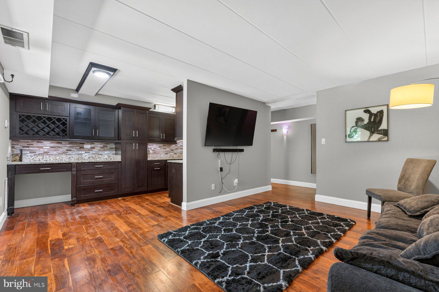 New Price! Same amazing home, even better value! The Reston, VA Lifestyle You've Been Seeking! Welcome to 2330 Freetown Court #4/1B, a stellar and move-in ready 2 bedroom and 1 full bath condominium nestled within the desirable Glenvale community in the heart of Reston, offering the perfect balance of comfort, convenience, outdoor recreation, and access to one of Northern Virginia's most sought-after lifestyles. Freshly painted throughout in 2026 prior to market, this inviting residence showcases bright, light-filled living spaces, a functional open layout, and attractive hardwood flooring that extends throughout the kitchen, living room, hallway, and bedrooms, creating a warm and cohesive appeal. Large windows bring in abundant natural light while framing views of the surrounding mature trees and landscaped grounds. The spacious living room with access to the rear patio and community open space with a playground, benches and walking trail creates an ideal setting for both everyday living and entertaining, while the well-designed kitchen offers ample cabinetry, generous workspace, granite countertops and durable hardwood flooring that blends beauty and functionality. The sizable primary suite provides a peaceful retreat, and the flexible floorplan with a second bedroom offers options for guests, a home office, or fitness space. The bathroom is thoughtfully appointed with ceramic tile flooring and separate granite-topped vanities, adding an elegant touch to the home's well-maintained interior. Everyday convenience is enhanced by the in-unit washer and dryer, a private exterior storage room located immediately adjacent to the left of the residence, and a rear concrete patio that provides the perfect space for morning coffee, outdoor relaxation, or enjoying the peaceful surroundings. Commuters will especially appreciate being just steps from a community bus stop, providing easy access to nearby Metro stations, shopping, and employment centers. Beyond the home itself, residents enjoy all the benefits of the renowned Reston lifestyle, including miles of interconnected walking, jogging and biking trails, community pools, tennis and pickleball courts, parks, playgrounds, athletic fields, and easy access to nearby Lake Thoreau, Lake Audubon, and Lake Anne. Additional commuter advantages include convenient proximity to the Silver Line Metro stations, Dulles Toll Road, Route 7, Fairfax County Parkway, Reston Town Center, and Dulles International Airport. Shopping, dining, entertainment, farmers markets, waterfront experiences, and everyday conveniences are all just minutes away, making it easy to enjoy everything this vibrant community has to offer. The HOA/condominium fee includes water, sewer, gas and trash service, and permit/reserved parking passes adding additional value and convenience. Combining a move-in ready interior, attractive finishes, scenic surroundings, exceptional community amenities, everyday conveniences, and an unbeatable location close to major employers, transportation, recreation, and entertainment, 2330 Freetown Court #4/1B presents a rare opportunity to own in one of Northern Virginia's most established and welcoming communities. More to see and experience. Shows beautifully! See virtual video tour in listing. You'll be proud to call this "Home"!