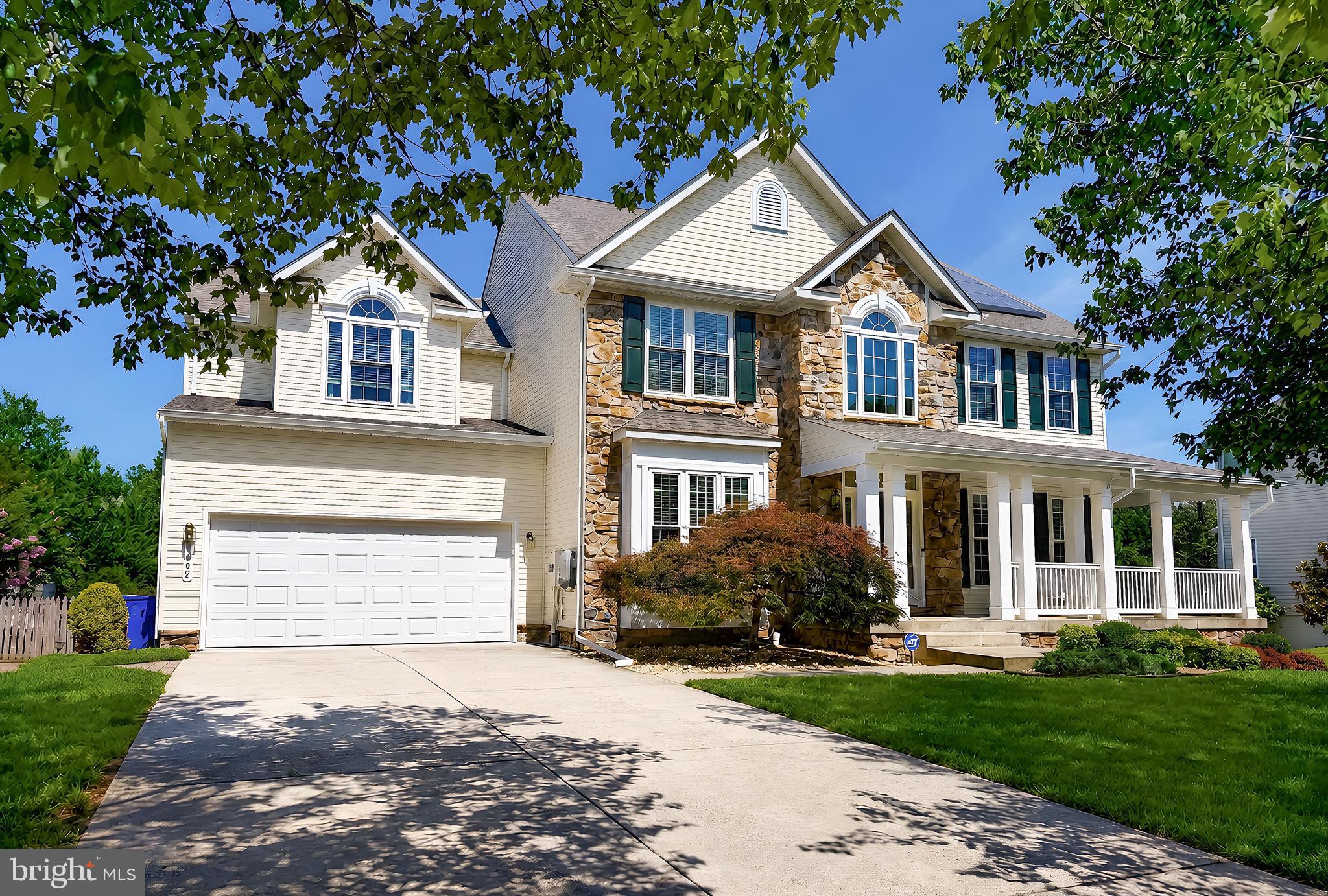 Discover a luxurious lifestyle in this stunning Colonial home nestled in the prestigious Kings Grant community. This comfortable residence boasts exquisite stone and vinyl siding, offering both elegance and durability. Step inside to find a spacious layout featuring a double staircase, a family room that seamlessly connects to the gourmet kitchen, complete with upgraded countertops and stainless steel appliances. The main level is adorned with rich wood floors and plush carpeting, creating a warm and inviting atmosphere. Retreat to the primary suite, where a lavish soaking tub and walk-in shower await. The fully finished basement provides additional living space with a level walkout, perfect for entertaining. Outside, enjoy extensive hardscaping, a beautiful 45' x 26' gunite pool, and beautifully landscaping. With a wrap-around porch and deck, outdoor living is a delight. This home also features energy-efficient windows, a security system, and ample parking with a two-car garage. Experience comfort and sophistication in every corner of this exceptional property. See it for yourself today!