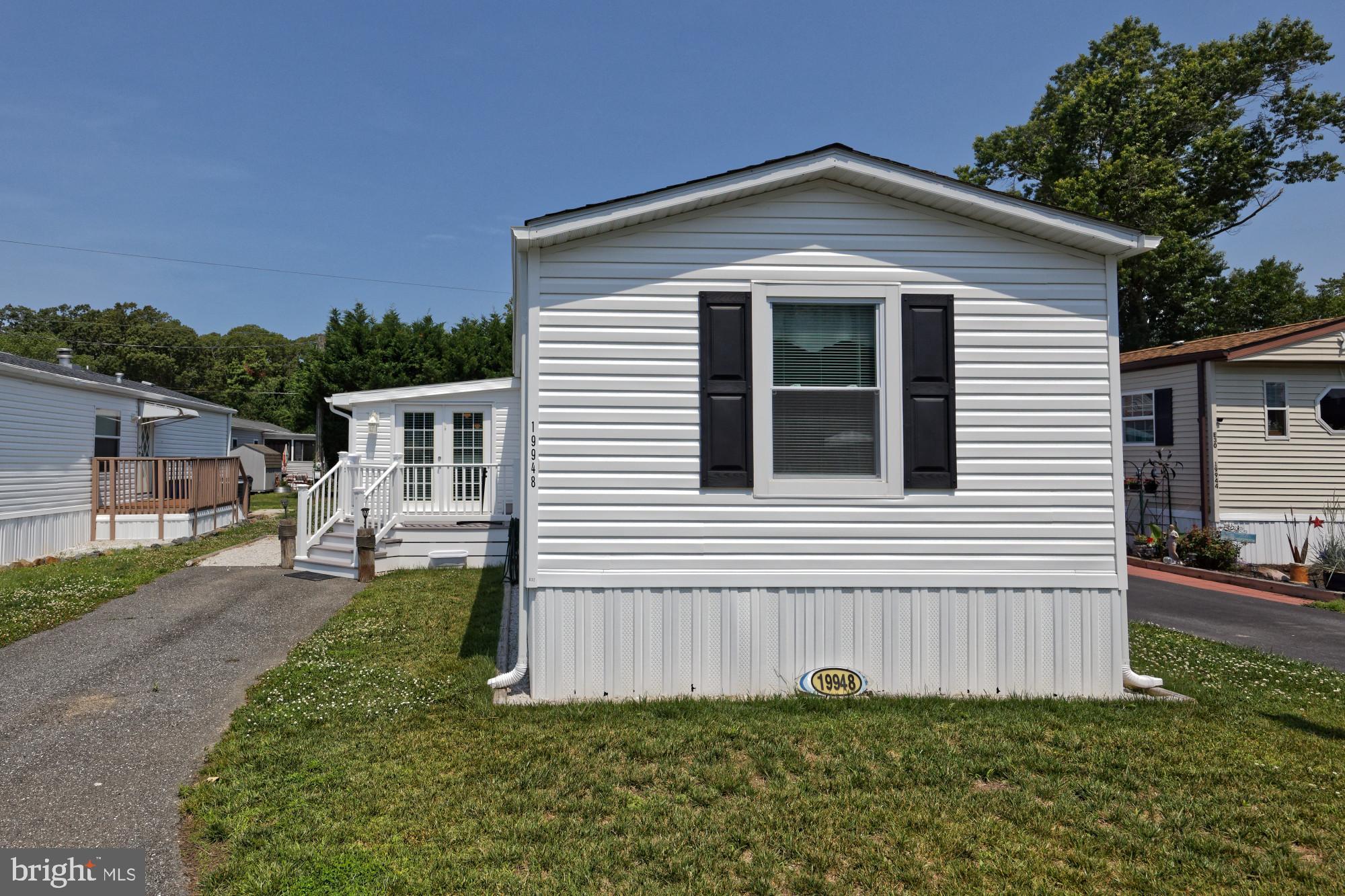 Walk to dining, bike to the beach, and live the coastal dream! Situated less than 2 miles from downtown Rehoboth Beach, this updated 3-bedroom, 2-bathroom home offers modern style in an unbeatable location. The turnkey interior shines with brand-new paint and beautiful LVP flooring throughout. The primary bathroom has been elegantly upgraded with a custom tile shower. For those who love to lounge, the massive 380 square foot added sunroom provides a massive footprint of extra living and entertaining space. Located in the land-lease community of Sea Air Village, residents enjoy immediate access to two community pools, a poolside bathhouse, a picnic pavilion, a playground, and a dog park for your furry friends. Incredible convenience meets beachside comfort—come see it before it's gone!