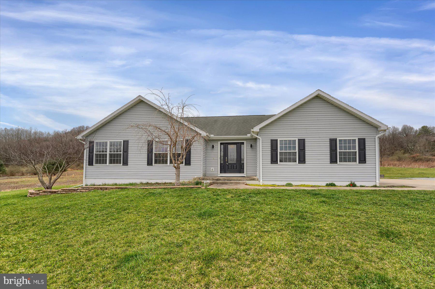 Welcome to this lovely modern ranch home, nestled on a peaceful 2.15-acre property in the serene rural setting of Warriors Mark. Enjoy stunning views and privacy as the property backs up to lush woods at the end of quiet Champaign Lane. While this home offers the tranquility of rural living, it’s still conveniently close to town for all your daily needs.
This well-maintained home features a spacious layout, including a large 2-car garage and a beautifully level yard with raised garden beds, a cozy fire pit, and a charming chicken coop—perfect for those looking to embrace outdoor living. The expansive full basement offers high ceilings and is ready for finishing, providing endless possibilities for additional living space.
The heart of the home is the large kitchen and dining area, featuring a two-tier island, stainless steel appliances, and a pantry—ideal for cooking and entertaining. The bright and airy living room boasts a soaring cathedral ceiling, a propane fireplace, and access to a large rear deck, complete with a gazebo cover for outdoor relaxation and gatherings.
Bonus Opportunity: The adjoining 4.47-acre lot(PAHU2023418) is also available for sale, offering the potential to expand your outdoor space for even more privacy and recreation.
Don’t miss the chance to make this stunning property your home, where peaceful rural living meets modern comfort and convenience.  All measurement made by electronic device to be verified by the buyer.