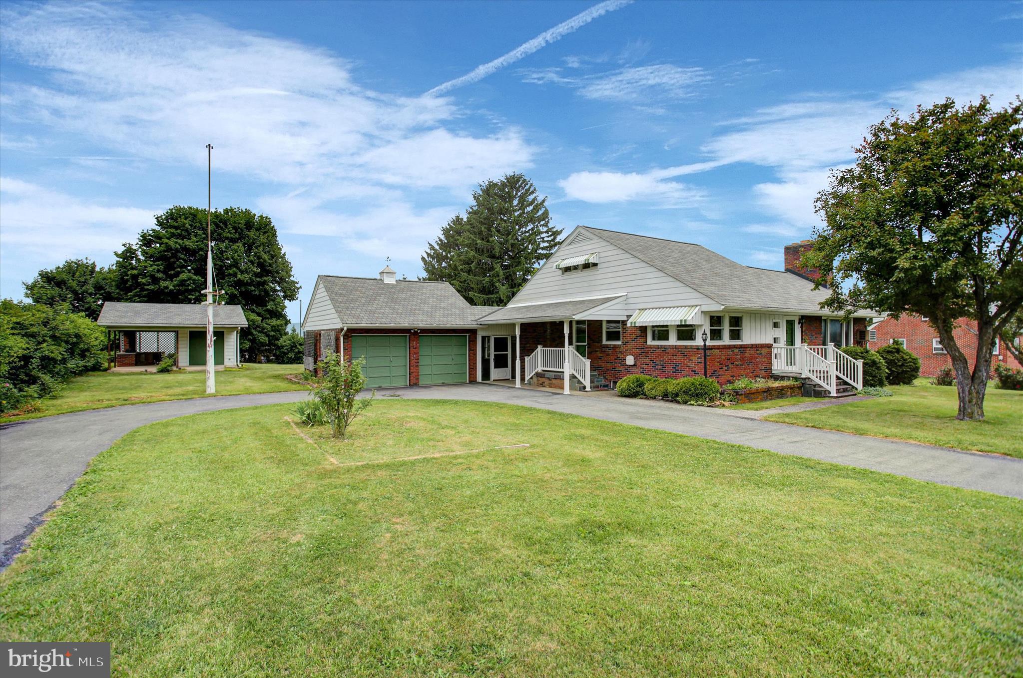 JUST LISTED! Exceptional value and space await at 580 Buchanan Trail West, McConnellsburg, Pa! This move-in-ready, 3-bedroom brick rancher sits on a spacious  1/2 acre lot and offers over 2,400 sq. ft. of finished living space. The main level shines with hardwood floors, a propane fireplace, classic built-ins, and replacement windows. The full bath features a ceramic-tile shower, a brand-new floor, and a handicap-accessible whirlpool tub, with an adjacent laundry room. Need more space? The lower level includes a large rec room, a utility room, and a complete 2nd full kitchen!

Your outdoor oasis includes a breezeway, a covered patio with a built-in BBQ pit, a handy workshop, and an extra storage shed. Parking is a breeze with the circular driveway and oversized 2-car garage.  Enjoy the perfect blend of small-town charm and convenience, located within close distance to local shopping, dining, and everyday amenities.