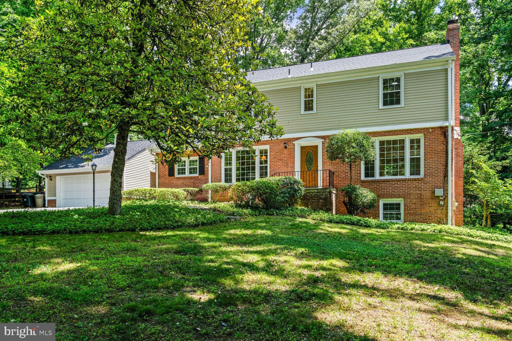 ELEGANT 2-LEVEL EXPANSION WITH LUXURIOUS UPGRADES IN BETHESDA

Welcome to this stunning 4-level Colonial, featuring exceptional curb appeal and a remarkable 2-story, 800 sq. ft. addition. Nestled in a prestigious neighborhood where the next door recently sold for $3.8 million, this home has been impeccably updated to blend luxury with functionality.

Set on a tranquil 0.57-acre wooded lot in the highly sought-after Churchill High School district, this nearly 5,000 sq. ft. residence offers 6 bedrooms, 4.5 bathrooms, 2 kitchens, 2 laundry rooms, and a walk-out lower level that functions as a fully equipped 2-bedroom apartment. Perfect for multi-generational living or rental income, this unique property offers unparalleled versatility.

The main floor boasts a spacious Living Room with gleaming hardwood floors, classic crown molding, abundant natural light, and a cozy wood-burning fireplace—ideal for entertaining or unwinding.   Adjacent, a formal Dining Room flows seamlessly into a recently renovated Chef’s gourmet Kitchen.  Highlights include a Quartz waterfall island, stainless steel hood, brand-new refrigerator, and high-end stainless steel appliances. With brand new LVP flooring, the kitchen opens into an expansive, versatile space that serves as a  breakfast area, play room, or an office, and a morning room with access to a breezeway that leads to the 2-car garage. Step into an inviting Family Room addition with sliding glass doors, leading to a sizable Trex deck, perfect for outdoor gatherings.  Rounding out the main level is a convenient powder room, situated behind the foyer. 

The upper level features a luxurious 16’ x 25’ primary suite addition, showcasing a spa-like bathroom with a free-standing soaking tub, oversized glass shower, double vanity, and a custom walk-in closet. A near-by laundry closet adds convenience. The guest suite with an en-suite bathroom, two additional bedrooms with built-in storage, and a shared hall bathroom complete this level.   An oversized attic loft offers additional bonus space, perfect for a playroom, storage, or an office.

The walk-up lower level is designed to impress, featuring a large recreation room, second kitchen, two legal bedrooms, full bathroom, and a second laundry room. With abundant natural light and private access, this level offers the perfect set up for guests or tenants.

Recent upgrades include a new roof (2022), new windows (2022), energy-efficient heat pump (2022), basement flooring (2023), new refrigerator (2024), new high-end water treatment system (2024), and luxury vinyl plank flooring in the kitchen and family room (2025).

Enjoy the serene backyard with direct access to trails leading into Cabin John Park, while being minutes from I-495, I-270, River Road, and Potomac Village. Proximity to NIH, downtown Bethesda, and premier dining and shopping further enhance this home’s incredible value.