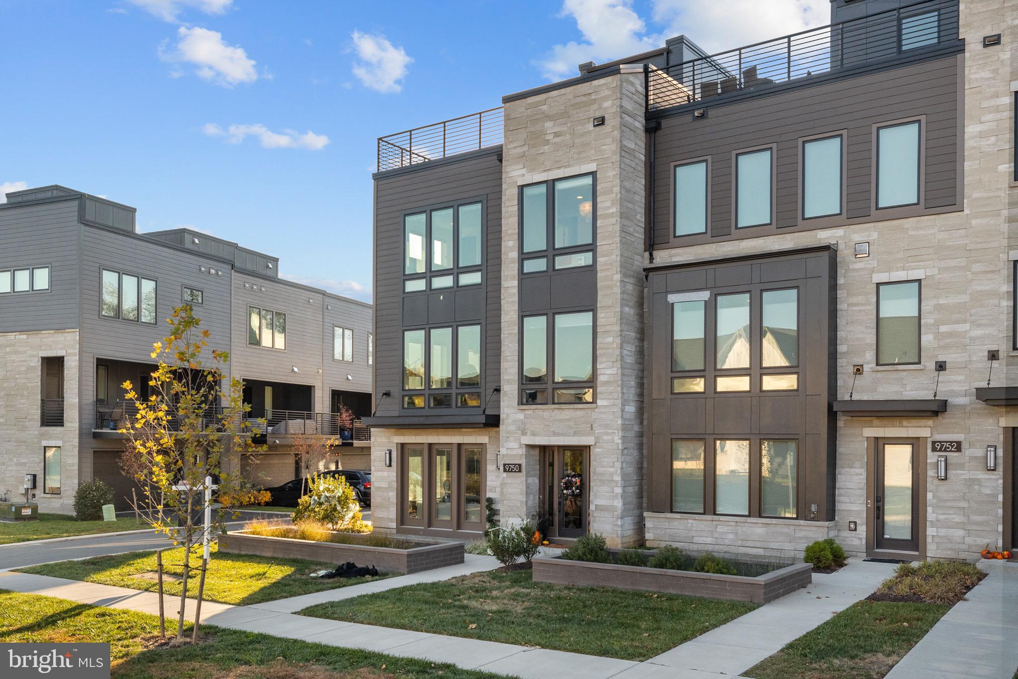 MASSIVE  PRICE IMPROVEMENT! One of your only opportunities to move into the Amalyn community!  Unparalleled Luxury — Exquisite End-Unit Townhome with Private Elevator - Your Dream Home Awaits in the Prestigious Amalyn Community!
Experience the pinnacle of modern elegance and sophistication in this impeccably designed Madera end-unit townhome, offering nearly 3,300 square feet of refined living space. Since its construction, this residence has been enhanced with extensive premium custom upgrades, providing a lifestyle defined by comfort, convenience, and timeless luxury.  Featuring 4 spacious bedrooms, including one on the ground floor, 3.5 bathrooms, on 4 light filled levels.

Key Features & Upgrades:
Private Elevator — Enjoy effortless access to every level, offering ultimate convenience and accessibility.
Stunning End-Unit Design — Flooded with natural light from expansive window walls, creating an airy and inviting atmosphere with exceptional privacy.
State-of-the-Art Smart Home Technology — Features an advanced security system, video surveillance, custom shades, built in speaker system and high-speed internet for modern living.
Roof Top Deck to relax and unwind after a long day, with outdoor speakers.
Covered outdoor living space off of kitchen.
High end finished closets.
Whole Home Water Softening & water filtration systems.
High End Jenair appliances including blended Panel refrigerator.
Statement island with bar seating and pendant lighting.

Resort-Style Community Amenities:
Take full advantage of Amalyn’s exclusive, resort-inspired amenities. The community clubhouse, located just steps away, offers an outdoor pool and splash pad, fitness center, outdoor kitchenette, locker rooms, and a media and gathering area. Stroll through the Zen garden, pocket parks, tot lot, and picturesque walking trails that wind throughout this thoughtfully designed neighborhood.

Prime Location:
Conveniently situated near top-rated schools, shopping, dining, and entertainment, this home offers easy access to major transportation routes—making commuting to Bethesda, downtown Washington, D.C., area airports, and METRO stations effortless.
Located just minutes from Balducci’s Grocery, Montgomery Mall, NIH, Walter Reed, and the vibrant retail and dining destinations of downtown Bethesda and D.C.
Zoned for Ashburton Elementary, North Bethesda Middle, and Walter Johnson High School.

Welcome Home!