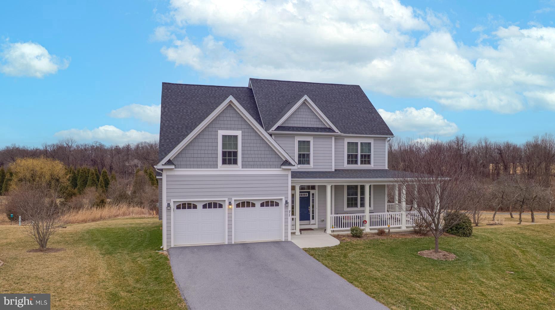 Now available!  Meticulously maintained, custom-built home located in the desirable neighborhood of Deerfield Village and minutes from the local park, shopping center, Shepherd University, and downtown Shepherdstown shops and eateries.  This 4 bedroom, 2.5 bath home features an open floor plan on the main level with a gourmet kitchen and Kitchen Aid appliances, double ovens, granite countertops, ample cabinet space, and a dining area that flows into the spacious family room with fireplace and connects to the outdoor deck space that lends itself perfectly to outdoor grilling and entertaining.

Upon arriving at the home, you will notice the covered wraparound porch complete with furniture space for front porch relaxation.  Entering the front door, you will notice the hardwood flooring that makes its way into the front office room which can also function as a dining room if desired.  This room connects to the gourmet kitchen which openly flows into the spacious family room that features a gas fireplace and connects to the private rear deck.  Upstairs, there is a magnificent primary suite complete with a sitting area, vaulted ceiling, and walk-in closet with complete custom wardrobe shelving.  The primary bathroom features a double vanity plus a separate soaking tub and shower.  Also upstairs are three more nicely sized bedrooms complete with closets and custom wardrobes.  There is a well-appointed full bathroom located off the main hallway that can be utilized by the bedrooms.  Downstairs in the basement area is lots of space to make your own recreation or cinema room.  There is a walkout to the backyard which is located not too far from the community walking trail.  Add in the two-car garage for covered parking plus storage space, and this home is move-in ready and waiting for its new owner.  Book your showing today while this must-see property is available!
