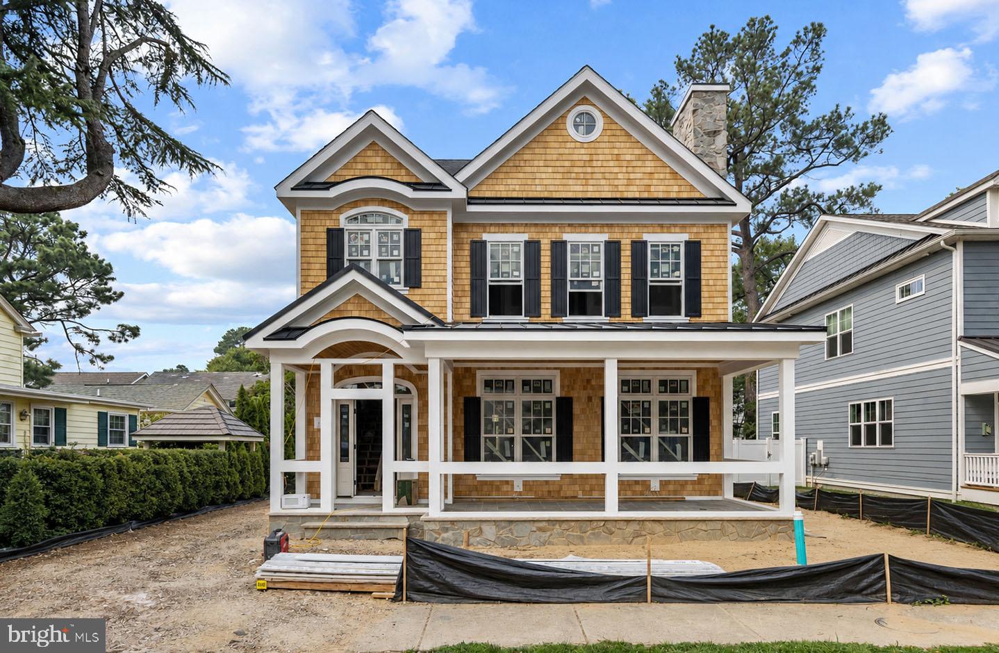 New construction custom home in South Rehoboth! Located just over two blocks from the beach, 209 New Castle Street offers the ideal coastal retreat—perfect as a summer getaway or a stunning year-round residence. This thoughtfully designed home features 4 bedrooms, 4 full baths, 2 half baths, and private en-suite baths in every bedroom, along with a spacious open-concept floor plan, a light-filled gourmet kitchen, and a private backyard oasis complete with an in-ground pool. A welcoming foyer sets the tone with white oak hardwood floors that continue throughout the home. The main living area is both stylish and comfortable, showcasing a gas fireplace flanked by custom built-in bookcases, coffered ceilings, and a seamless flow for effortless entertaining. At the heart of the home is a show-stopping gourmet kitchen featuring an oversized island, granite countertops, and a premier Wolf/Sub-Zero appliance package, including a 6-burner gas range with hood, French door refrigerator, drawer microwave, and dishwasher. The adjacent dining area is filled with natural light and enhanced by a convenient beverage bar with additional refrigeration—ideal for hosting family and friends. Step outside to enjoy a fully fenced backyard offering privacy and relaxed coastal living, centered around the in-ground pool—perfect for summer afternoons after the beach. Upstairs, all four bedrooms feature 9-foot ceilings and beautifully finished spa-inspired tiled baths, providing comfort and privacy for owners and guests alike. Just steps from Rehoboth Avenue, you’ll enjoy immediate access to award-winning restaurants, boutique shopping, and the beach and boardwalk. The floor plan also offers the option to reconfigure the first level to include a rear poolside screened porch. Photos are of a similar home. The property is available for showings.