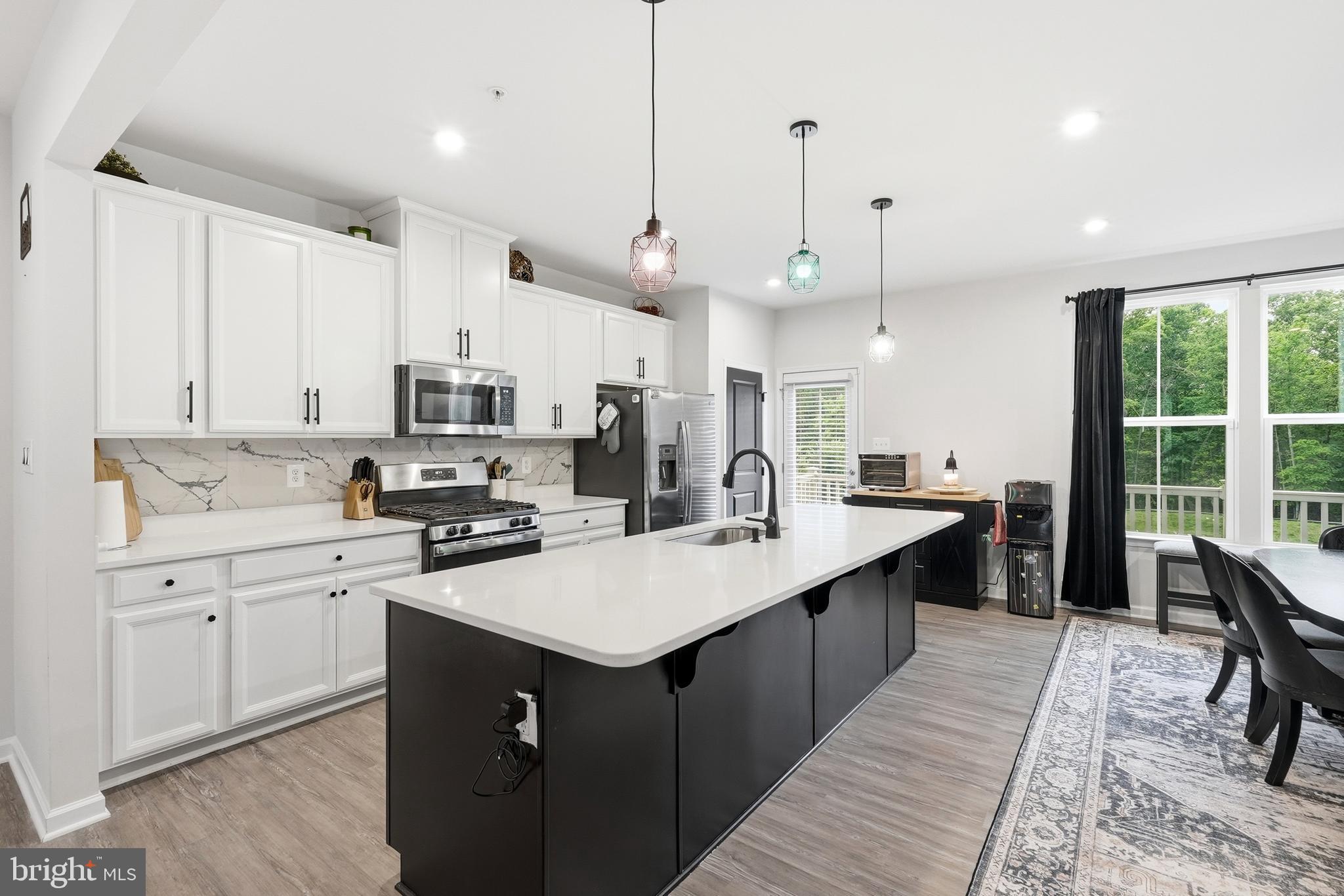 The best homes are the ones that make you feel at home the moment you walk through the door. Built in 2020 and offering 2,280 square feet across three finished levels, this Westchester Square townhome was designed for the way people live today. The open main level creates a welcoming space where meals, conversations, celebrations, and everyday moments naturally come together. On  the upper level, you'll find three bedrooms, including a primary suite and the convenience of the laundry. Beyond the interior, the wooded backdrop offers a peaceful setting to unwind after a long day, while community amenities including an outdoor pool, parks, lawn care, and snow removal allow you to spend less time on maintenance and more time enjoying where you live. Complete with a two-car garage and conveniently located near shopping, dining, and commuter routes, this home offers the space, comfort, and lifestyle you've been searching for. The photos are beautiful, but the feeling of home is something you'll have to experience in person.