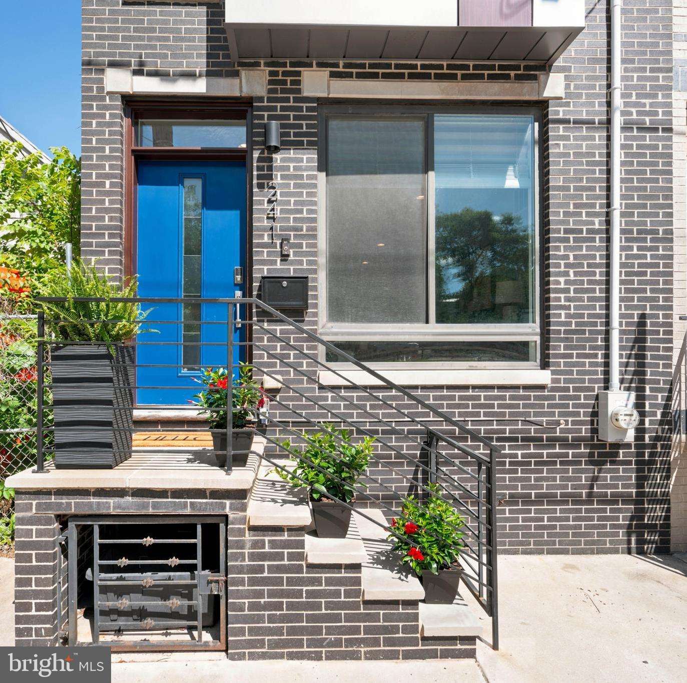 Welcome to this stunning 2018-built home in one of Philadelphia's most desirable and rapidly growing neighborhoods. Approx. 2 years remaining on Philadelphia tax abatement (buyer to verify). 
This oversized residence combines modern luxury, exceptional living space, and breathtaking Center City skyline views.

Designed with today's lifestyle in mind, the home features a bright and expansive open-concept floor plan, creating seamless flow between the living, dining, and kitchen areas. Whether entertaining guests or enjoying a quiet evening at home, the spacious layout provides the perfect setting for comfortable city living.

One of the larger homes in the area, this property offers 3 generously sized bedrooms plus a versatile bonus 4th bedroom with its own living space, making it ideal for guests, a home office, gym, media room, or in-law suite. The home also features 3.5 beautifully finished bathrooms with elegant tilework throughout.

The beautifully designed kitchen showcases custom cabinetry, granite countertops, a large center island with pendant lighting, a stylish tile backsplash, and stainless steel appliances, creating the perfect space for both everyday living and entertaining. Step outside of the kitchen sliders to a beautiful enclosed patio area/yard for relaxation and entertaining.

The entire third floor is dedicated to a luxurious primary suite featuring walk-in closets, a spa-inspired bathroom, and a tray ceiling accented with crown molding and ambient lighting. Hardwood floors run throughout the home, adding warmth and sophistication to every level.

Take in the incredible rooftop deck with a wet bar landing—huge rooftop is perfect for entertaining while taking in spectacular views of the Philadelphia skyline.

Additional features include built-in speakers, video doorbell, Nest thermostat, alarm system, and quality construction by V2 Properties. The striking exterior combines classic brick construction with a designer standing-seam metal-sided bay and decorative iron railing for exceptional curb appeal.

Located just minutes from Center City, this home places you at the center of everything Philadelphia has to offer. Enjoy easy access to Brewerytown, Fairmount, Francisville, Temple University, the Philadelphia Museum of Art, Boathouse Row, Kelly Drive, Fairmount Park, and the Schuylkill River Trail. Explore countless nearby restaurants, breweries, coffee shops, cultural attractions, parks, and entertainment venues. Commuters will appreciate the proximity to Broad Street, major transportation routes, and public transit options.

With modern construction, oversized bedrooms, flexible living space, stunning skyline views, tax savings, and an unbeatable location near Philadelphia's most sought-after destinations, 1241 N. 19th Street offers an exceptional opportunity to experience the very best of city living.