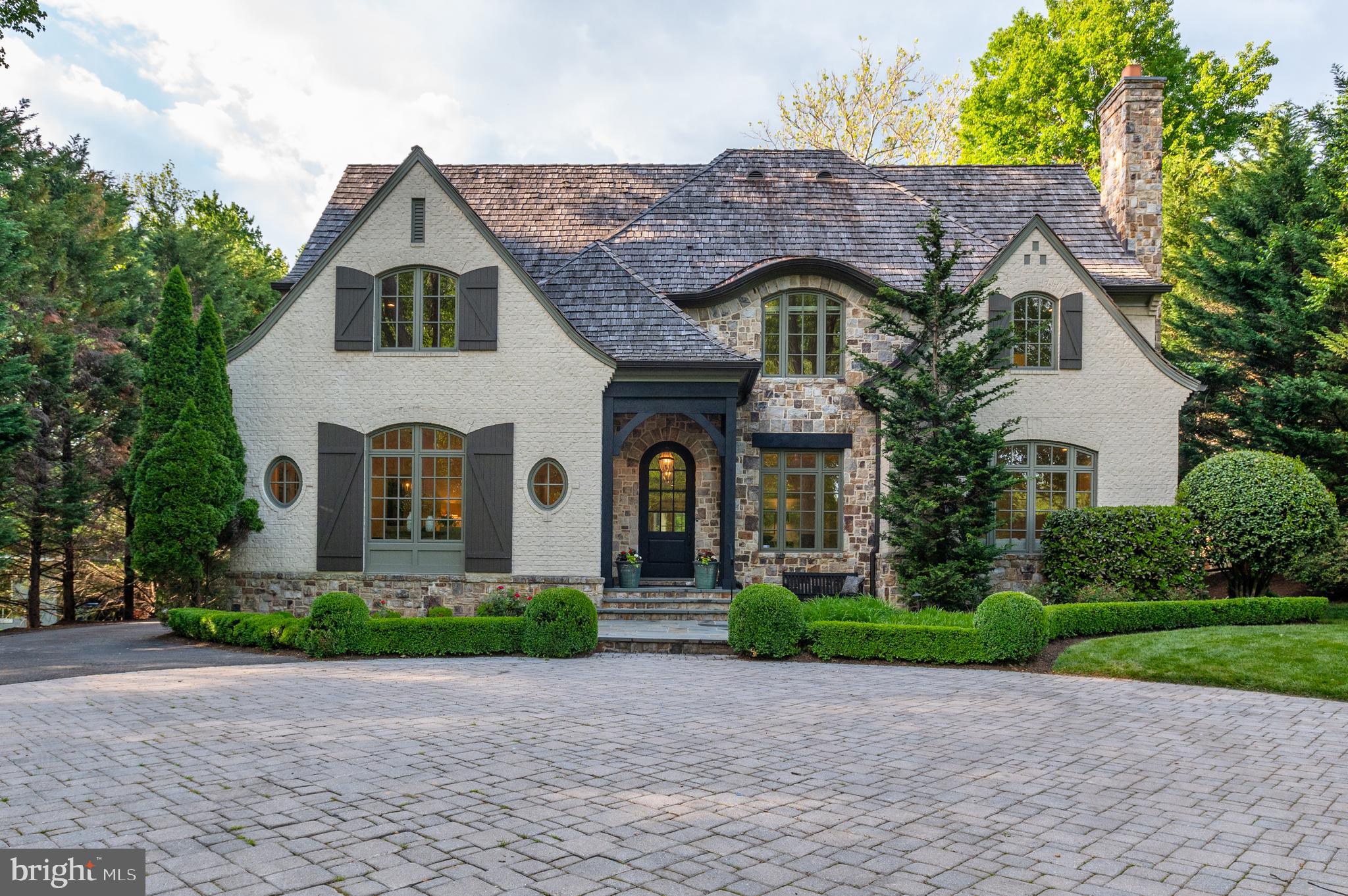 This Stunning French provincial custom-built Artisan home sited on nearly 3/4 of an acre in prestigious LANGLEY FOREST.  The home  has been freshened and updated throughout its 8,800 square feet of living space. With a light-filled and flowing floor plan, the main level includes a gourmet kitchen with high end appliances, eat in kitchen  and a family room with a stone fireplace that overlooks the gorgeously landscaped backyard and perfect for entertaining.  Upstairs, you will find an expansive primary suite with a luxurious updated bathroom, 3 additional bedrooms with en suite baths and a separately accessed in-law/nanny suite.  The lower level offers optimum living space with separate kitchen area, media room and the 6th full bed with en suite full bath and an additional half bath.  This large manicured lot is perfect for adding a pool and still have plenty of yard space to enjoy.    Quiet street with no cut through access and a cul-de-sac at the end of the block.  Easy access to DC, Tysons and the Reston Tech Corridor.