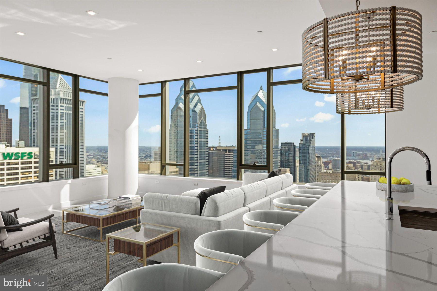Welcome to The Laurel, Rittenhouse Square’s most prestigious residential address, where architecture, service, and lifestyle converge at the highest level. Spanning approximately half a floor, Residence 4402 is a rare offering that pairs grand scale with sweeping, uninterrupted panoramic views across the Philadelphia skyline.
 
This impeccably designed 3-bedroom, 3.5-bath residence encompasses 3,622 square feet and is defined by 10-foot ceilings and walls of glass that frame the city from nearly every vantage point. The layout flows effortlessly from formal entertaining to private retreat, creating a residence equally suited for intimate living and large-scale gatherings.
 
The interiors are finished to the highest standard, with custom rosewood veneer cabinetry throughout the kitchen and wet bar, accented by smoked eucalyptus glass and a refined lacquered finish. Calacatta quartz countertops with waterfall edges anchor the kitchen, while Dolomite marble flooring extends through the living spaces and primary bedroom suite. A fully integrated wet bar with pass-through enhances the entertaining experience, seamlessly connecting kitchen and living areas.
 
Three private balconies extend the living space outdoors, offering multiple settings to enjoy sunrise, sunset, and city lights. The primary suite is a sanctuary unto itself, featuring its own balcony, generous proportions, and an elegant spa bath appointed with a 67-inch cast-iron soaking tub, Calacatta slab walls, and heated mosaic marble floors. Oversized custom closets provide exceptional storage without compromising design.
 
The residence is equipped with a full suite of top-tier appliances, including Sub-Zero refrigeration, Wolf cooking, and Miele dishwashers, as well as electronic shades in the primary bedroom and main living areas for effortless control of light and privacy.
 
Life at The Laurel is elevated by what are widely regarded as the finest amenities in Philadelphia. Residents enjoy an unmatched collection of indoor and outdoor pools, a serene spa with sauna and steam rooms, a state-of-the-art fitness center and yoga studio, and beautifully appointed club spaces and terraces overlooking Rittenhouse Square. White-glove service and thoughtful details throughout the building create an experience that rivals the world’s finest luxury residences.
 
Residence 4402 includes a parking license and offers a rare opportunity to own a half-floor home in Philadelphia’s most exclusive condominium. Private showings are now available.
