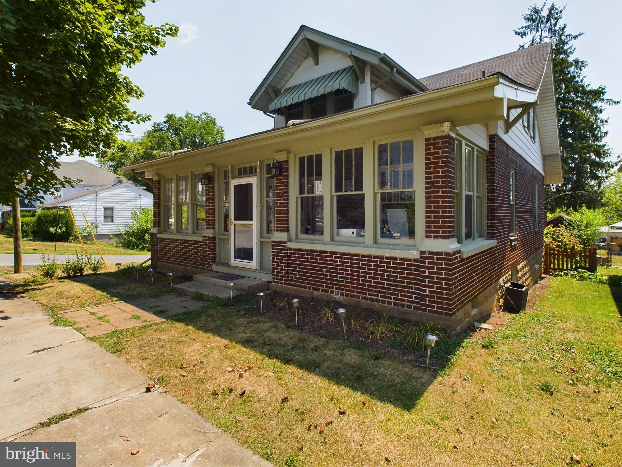 Welcome to this 1930 Craftsman-style home, where classic charm meets modern convenience. This now 4-bedroom, 2 full bath gem boasts original hardwood floors nearly throughout, preserving the home's original character while offering a warm and inviting ambiance. The enclosed front porch adds extra storage room or use it for a 3-seasons entry to enjoy city living. Inside the home, you'll be met by the large family room with French doors to add privacy and peace. Next, the formal dining room is a space for meals and entertainment as this room too, is quite large. The kitchen area is an addition added years ago but allows the dining room to really open up for more space. PVC plumbing was added in 2008, NG water heater changed in 2022, A/C HVAC added in 2018 and a new sump pump was added in 2019. 

Key Features:

4 Bedrooms (2 main, 2 upper) : Ample room for family, guests, or a home office.
2 Full Baths: Remodeled/Conversation upper full bath added unused space to add a stand-up shower, soaker tub and extra storage. Full bath downstairs was added while borrowing some of BR4's space. A laundry hookup was also added. 
Hardwood Floors: Original hardwood flooring extends through most of the home, adding elegance and durability.
Full Basement: Once used as a dedicated office space setup, perfect for remote work, study or home gym.
Privacy Fenced Rear Yard: Enjoy your own private oasis, ideal for outdoor gatherings, gardening, or relaxing in peace.
Rare 1-Car Detached Garage: A unique find, providing secure parking and extra storage space within the city limits. Has electric and power door opener. 
Corner Lot: Enhances privacy and offers a generous outdoor space for activities and landscaping.
Located in a desirable part of the city, this home is close to schools, parks, shopping, and dining, offering the perfect blend of comfort, convenience, and character. Don’t miss the opportunity to make this charming Craftsman your forever home. Schedule a tour today! Virtual Tour link available.