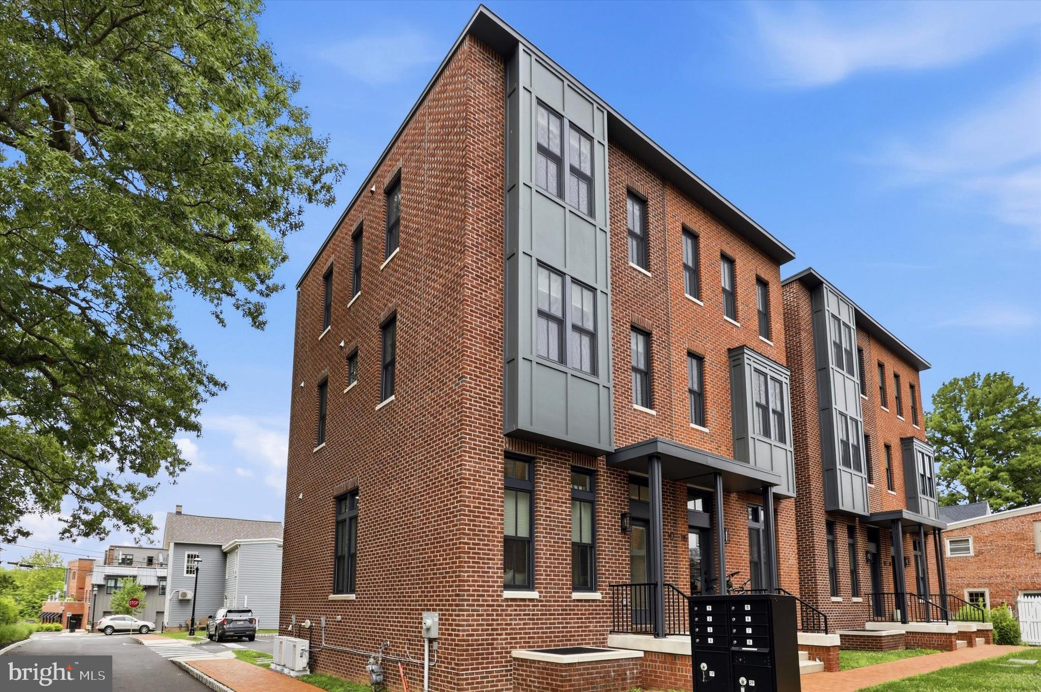 Looking for a walkable lifestyle?  Presenting 117 Thornton Lane, a stunning luxury brick corner townhome in the heart of Newtown Borough!  So much to do right outside your door; restaurants, shopping, the historic Newtown Theatre, taverns, ice cream shops and so much more!  This home features a spacious and bright chef's kitchen, with stainless appliances, white cabinetry, complimented by the dark quartz countertops and large Island.  Impeccable, light hardwood flooring throughout the home.  There is a possibility to install an elevator for all levels!   The open floor plan  flows from the kitchen into a dining area and inviting living room, perfect for entertaining.  Beautiful lighting fixtures, plenty of recessed lighting in the high ceilings on every level.   Finished basement can be utilized for a second living room, office or gym.  Upper levels have four bedrooms with generous walk in closets.  Three full baths throughout with elegant tile and oversized fixtures in the glass showers.  A few additional bonuses to the home; Multi-zone smart home nest thermostats to control heating and air conditioning, laundry room with front load washer and dryer  located on the upper level and TWO deeded parking spots in the community.  This walkable location is convenient for commuters that need to get on I-95 to travel to Philadelphia or New York City.  Come schedule your private tour today!