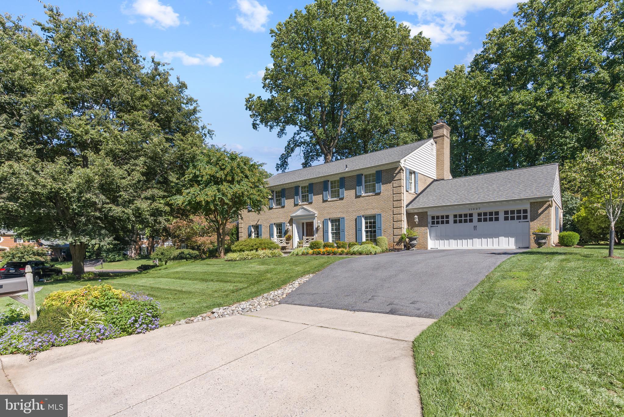Welcome Home! Gorgeous and completely updated brick colonial situated on serene lot, corner of cul-de-sac and located in highly sought-after Windermere community.  This magnificent home welcomes you with a “WOW” panoramic view into the house and entry into a bright, spacious foyer with beautiful hardwood floors throughout.  Large and sunlit formal dining room with floor-to-ceiling windows and French doors.  Whole house renovation by Whittington Design/Build added 500+ sq ft to kitchen and family room.  Chef’s kitchen with custom cabinetry, top of the line stainless steel appliances. Granite countertops and grand breakfast eat-in area and oversized windows.   Kitchen opens to light-filled, spacious family room with a stunning updated stone gas fireplace, all overlooking tranquil backyard.  Updated flagstone patio with custom outdoor cooking station and gas grill. Large mudroom with custom storage space also part of renovation, with laundry room moved upstairs to include folding station, custom cabinets and recently purchased washer/dryer.   AND, note the highly coveted enlarged home office and renovated powder room to complete the home’s first floor.   The upper level boasts spacious and sunny primary suite with custom walk-in closet and breathtaking renovated en suite bathroom by Potomac Designs, complete with two sink stone vanities, whirlpool bathtub, custom mirrors and lighting, dedicated water closet with Toto toilet, and oversized walk-in steam shower.  Second floor also includes three additional spacious bedrooms, with two renovated hallway bathrooms.  Expansive finished basement with custom lighting, large bedroom, full bathroom, and the golf room was built as part of the addition.   AND, a large 2 car garage, Electric Vehicle charger, updated garage door, recently paved driveway and recently replaced roof, HVAC, and hot water heater.    Top rated MOCO schools, minutes to I-495, I-270, Grosvenor Metro, Pike and Rose, Montgomery Mall, Cabin John Park and so much more!