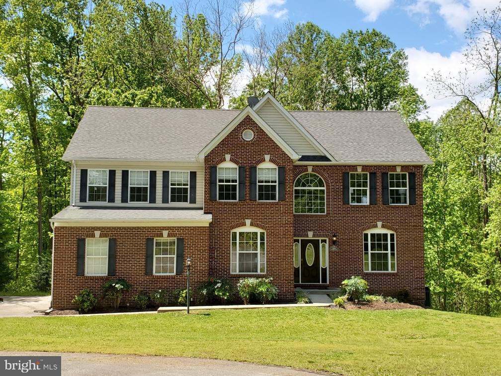 This gorgeous home is nestled on 2 acres of quiet, beautiful private land.  As soon as you walk into this stunning home you are greeted with a large 2 story foyer, hardwood floors and a beautiful double sided staircase. 5535 Fairfield Place boasts 5 bedrooms, 4 full bathrooms and 1 half bath. The extra large master suite has vaulted ceilings, a separate sitting room with built in mini bar, a large walk in closet and a beautiful en suite that  boasts its own 50 gallon hot water heater, 2 vanities, a large jetted tub, separate shower and separate water closet. The upper level also boasts 3 more bedrooms, 2 full bathrooms and a laundry room with a built in ironing board. No more hauling laundry up and down the stairs it's all on the upper level. The main level offers an office with double doors, a formal living room and a formal dining room perfect for holidays and special occasions. The extra large eat in gourmet kitchen has stainless appliances, brand new granite counters, lots of cabinets, a large pantry and is open to the extra large family room complete with high ceilings and a gas fireplace. This home is filled with natural light, as there are lots of large windows and French double doors off the kitchen that lead to one of three decks.  The basement is completely finished and boasts 1 bedroom with a separate dressing room, 1 full bathroom, open kitchen, dining room, living room, separate family/exercise/game room. You can access the basement from inside the home or through a separate entrance that also connects to a deck with a hot tub. This Home has been meticulously cared for and lovingly maintained.  The  property also offers a workshop that is on slab, wired and ready for use. It is measures 18' x 18' x 12'.    5535 Fairfield Place is minutes from commuter options, convenient to DC, Virginia and Southern Maryland.  Plenty of shopping, dining and entertainment close by.  All you have to do is move in and enjoy!Virtual Tour: https://my.matterport.com/show/?m=JZira2tZFBt&mls=1