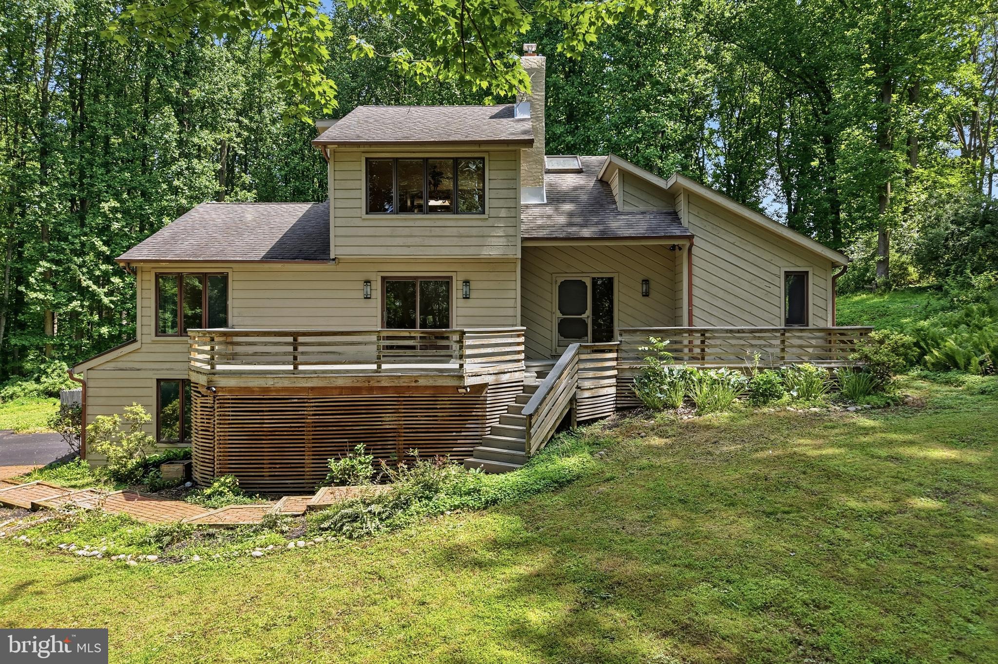 Handyman Special with Massive Upside! ARV $1,000,000+++! Welcome to 3 Upper Bank Drive, an incredible opportunity to create instant equity in one of the most sought-after locations in Chadds Ford. Situated on over 2 private acres, this spacious home offers endless potential and a setting that is hard to replicate, featuring a long driveway, oversized 2-car garage, expansive front and rear decks, a large backyard, and unmatched privacy. Inside, you'll find a bright and functional layout with a welcoming foyer, spacious living and dining areas, a large kitchen, laundry room, full bath, and two generously sized bedrooms on the main level. Upstairs features two additional bedrooms, including a fantastic primary suite complete with a walk-in closet and private ensuite bathroom. The finished lower level adds tremendous value with multiple recreation rooms, additional living space, a bonus bedroom, utility areas, and direct garage access. Location is everything, and this home delivers—just minutes from the shops, restaurants, and amenities of West Chester and Kennett Square, close to parks, trails, renowned golf clubs, Longwood Gardens, and major routes including Route 1 and Route 202. Located within the award-winning Unionville-Chadds Ford School District and near prestigious private schools, this property offers the perfect combination of space, privacy, convenience, and value-add potential. Being sold strictly as-is. Opportunities like this are rare—schedule your private showing today before it's gone!