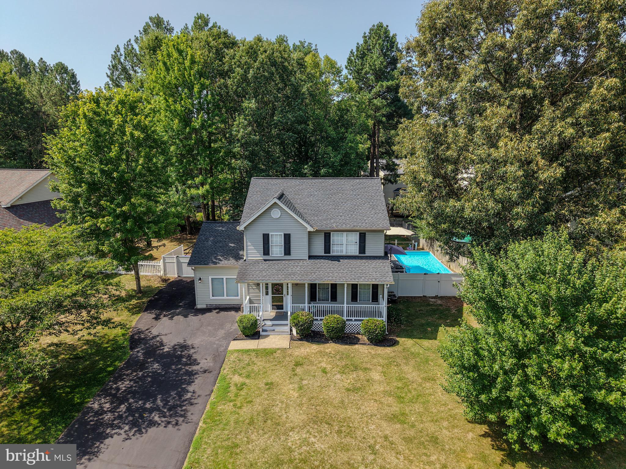 Just in time for summer! This beautifully maintained home in the sought-after Lancaster Gate community offers the perfect blend of comfort, style, and outdoor living. An inviting covered front porch welcomes you into a spacious foyer, leading to a large family room that flows seamlessly into the formal dining room—ideal for everyday living and entertaining. The custom-designed kitchen is the heart of the home, featuring two tone cabinetry, a farmhouse sink, luxury vinyl plank flooring, abundant storage, and a charming bay window bump-out that creates the perfect breakfast nook. The main level also includes a convenient powder room and a versatile flex space that can easily serve as a fourth bedroom, home office, or den. Upstairs, you'll find three bedrooms, two full bathrooms, and the convenience of an upper-level laundry area. The spacious primary suite offers a private retreat with a walk-in closet and an ensuite bath complete with a soaking tub, separate walk-in shower, double vanities, and a private water closet. Step outside and discover your own backyard oasis. Designed for summer entertaining, the expansive maintenance-free deck provides easy access to the 12' x 24' above-ground pool, while the patio and pergola provide the perfect setting for outdoor dining and relaxing. Two storage sheds offer plenty of room for lawn equipment and pool accessories, all situated on a level 0.23-acre lot. Additional peace of mind comes with a roof replaced in 2020. Residents of Lancaster Gate enjoy an abundance of community amenities, including playgrounds, ballfields, and walking trails, along with excellent schools and convenient commuter access. This exceptional home offers everything you need to enjoy the best of indoor and outdoor living.