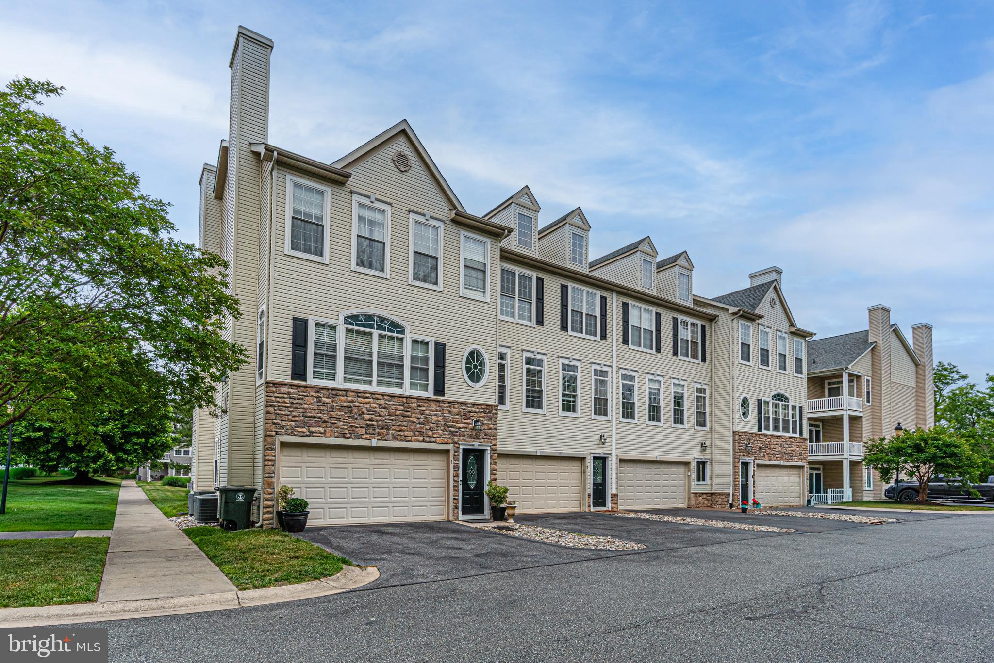 Here's your chance to live in America's Coolest Small Town at a great price!  PRICE IMPROVEMENT to $415,000.00!  Welcome to The Townes of Berlin, a small intimate townhouse community located in America's Coolest Small Town, Berlin, Maryland.   Comes with a 1 Year AHS warranty.!   This 3-story, oversized, townhome has 2560 square ft. of living space.  Freshly painted in neutral colors!  Featuring several outdoor spaces overlooking the community pond!  We begin our tour with a large flex space downstairs featuring 1/2 bath and a ground floor entrance from the large garage or covered patio.  Plenty of light thru the slider and wall of windows, this space offers unlimited uses; exercise, bedroom, guest or in-law space, playroom or office.  You'll find this space a true BONUS!  On the main floor, you will be pleasantly surprised by the large space with the convenience of a 1/2 bath and open floorplan all featuring LVP flooring.  The eat-in kitchen features warm wood cabinets, breakfast bar, stainless appliances, lg. dining area and a walkout balcony; a perfect space to enjoy the pond views and morning coffee.  Upstairs there are 2 bedrooms  (with ample closets) with a shared bath, PLUS primary suite with another private balcony, large, ensuite bathroom featuring walk-in closet, stand-up shower and soaking tub.  Located within Berlin, you'll find a grocery store, local banks, post office, variety of quaint shops, SUNDAY farmer's market and MANY popular restaurants.  Enjoy town celebrations like New Years, holiday parades, music festivals, car shows and the all-famous bathtub races!  Berlin was also featured in movies like Runaway Bride and Huck Everlasting.   Conveniently located Just 10-15 minutes to Ocean City and Assateague beaches!  Don't Hesitate, or you'll miss this one!