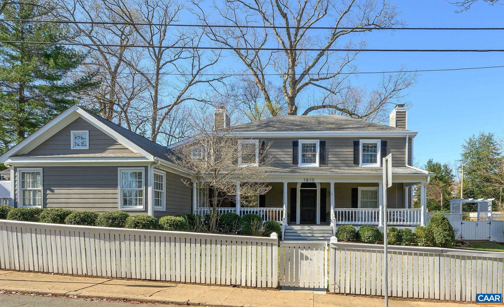 A short walk to Grounds, UVA Medical Center, all UVA sporting events, The Corner. Walk, bike or drive to Dairy Central, the Historic Downtown Pedestrian Mall, and the many restaurants and shops along West Main St. Enjoy the full front porch with porch swing and seating space. The south facing family room and dining room addition with abundant windows on three elevations is infused with natural light. The amazing renovated kitchen with breakfast room opens to the family room. The living room with fireplace and walls of built in bookshelves has windows and french doors on three sides. The expansive main level primary suite boasts a vaulted ceiling, sitting area, generous renovated bathroom and double walk-in closets. Upstairs are three bedrooms, one of which is ensuite and a second full bath. Hardwood floors throughout. Main level laundry and powder room. The private fully fenced yard enjoys a level lawn, stone terrace with plenty of room to entertain, or simply enjoy the outdoors. EV charger, solar panels, floored attic with pull down staircase for additional storage.,Painted Cabinets,White Cabinets,Wood Cabinets