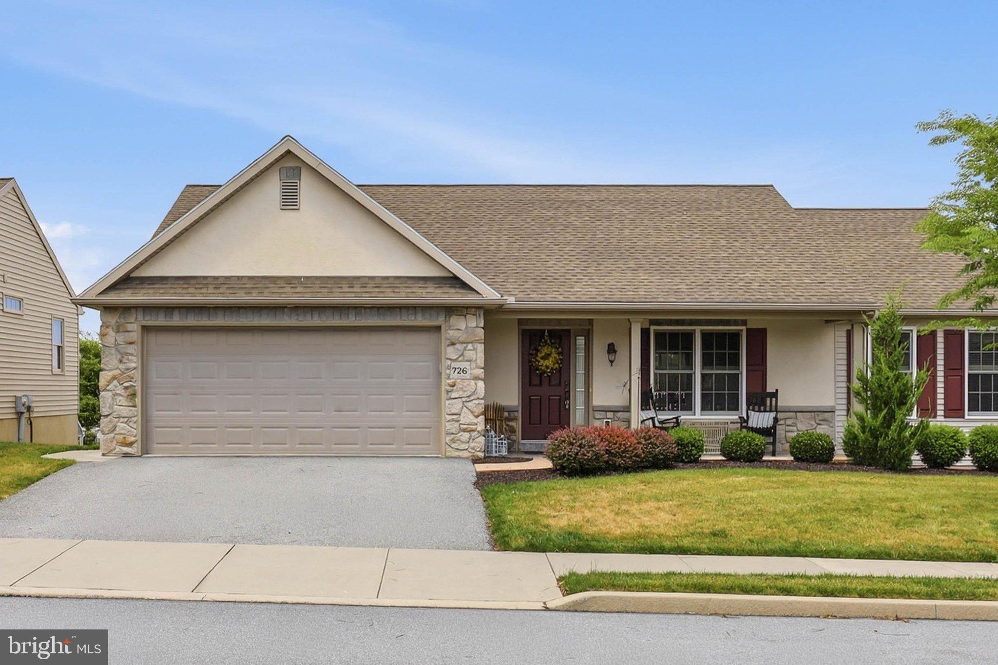 Welcome to 726 Heather Ridge, located in the highly desirable 55+ community of Brookshire in Manheim. This beautifully maintained ranch-style home offers the ease and convenience of first-floor living combined with an open and inviting floor plan designed for today's lifestyle. Step inside to find soaring vaulted ceilings, abundant natural light, and a spacious living area centered around a cozy natural gas fireplace. The well-appointed kitchen features stainless steel appliances and flows seamlessly into the main living and dining spaces, making entertaining effortless. The home offers 3 bedrooms and 2.5 bathrooms, including a spacious primary suite complete with a private bath and walk-in closet. Main-floor laundry adds to the home's convenience and accessibility. The finished walk-out lower level provides exceptional additional living space, perfect for entertaining guests, pursuing hobbies, creating a home office, or simply relaxing. You'll also appreciate the generous storage area. Outside, enjoy the meticulously maintained lot from the charming front porch or the rear deck; ideal for morning coffee, evening relaxation, and enjoying the peaceful surroundings. Brookshire residents enjoy a vibrant, active lifestyle with outstanding community amenities, including a café, salon, community center, outdoor recreational opportunities, and more. This move-in-ready home offers low-maintenance living in one of the area's most sought-after active adult communities. Don't miss the opportunity to make this exceptional property your next home!