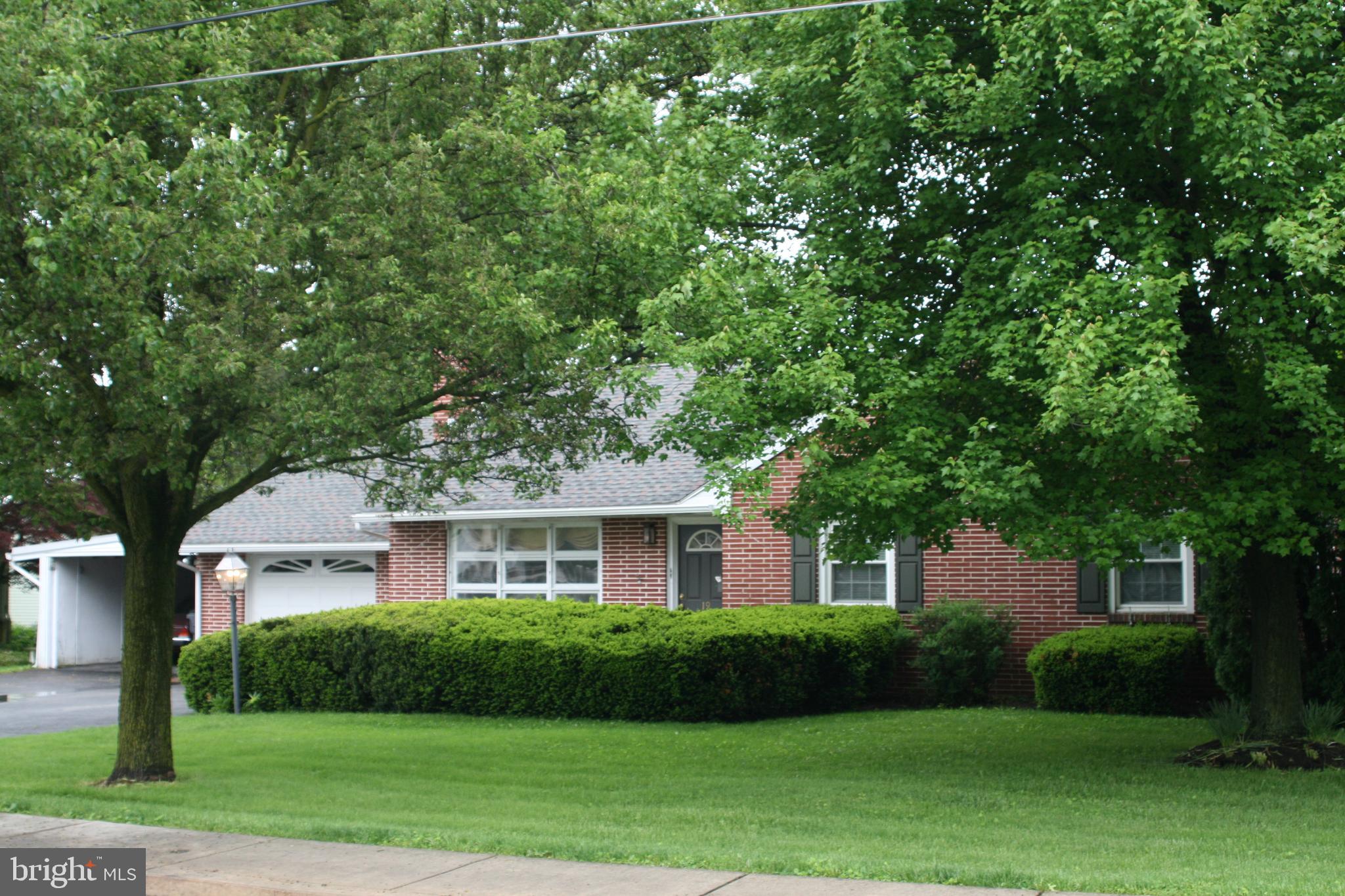 Historic Strasburg -Mid-Century   3 Bed Brick Ranch style home   Newer roof   excellent condition! Loaded with charm and lovingly maintained, lots of goodies included:  Newer Amana refrigerator, Bosch Dishwasher, Washer & Dryer!  Amenities include Gorgeous Hardwood floors, recently refinished, a Stone fireplace in the cozy living room, large eat in kitchen with newer appliances.  Enjoy sunset views through a large living room window.  Peaceful neighborhood, an easy walk to the Creamery and shopping at the Square in Strasburg.  Heated 1 car garage has a new garage door, a   bath plus a car port for additional covered parking.  Additional   bath in the LL with plenty of storage.  Call for your appointment today, easy to show.