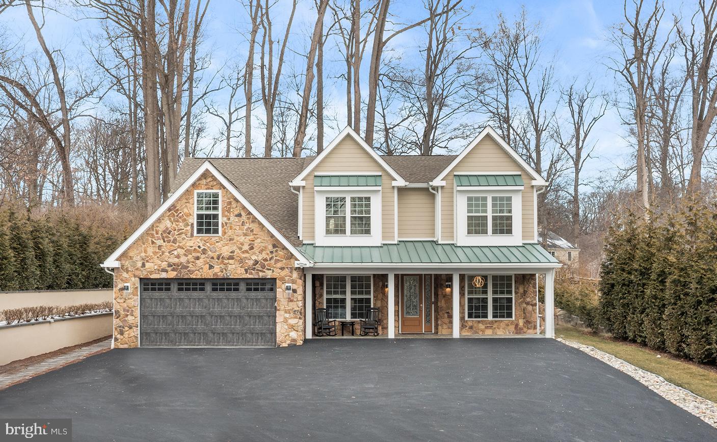 This home sits gracefully on a beautiful, private 1 Acre Lot, offering a sense of seclusion while still feeling perfectly placed.

Entering through the stunning leaded-glass front door, flanked by matching side light panels, you’re welcomed into a gracious entrance hall filled with natural light and refined architectural detail. To the left side is a Den with custom-built-ins that provide the perfect Home Office or quiet retreat, and on the right side is the formal Dining Room, which offers an elegant setting for gatherings and celebrations.

Straight ahead, the home opens into a magnificent open floor plan, anchored by a Gourmet Eat-in Kitchen designed for both everyday living and effortless entertaining.
The Chef’s Kitchen features premium appliances: a Dacor fridge, microwave, and dishwasher, and a top of the line Fulgor Milano induction range and range hood, custom cabinetry with glass-front cabinets above, a tile backsplash, and a generous center island with seating and storage. Enter the Butler’s Pantry with a beverage refrigerator that seamlessly connects from the Kitchen and Dining Room, adding both function and sophistication.

Beyond the Kitchen is the Breakfast eating area opening to the Patio with 2 retractable Awnings and a beautiful, flat, level backyard surrounded by rose bushes, creating a natural extension of the living space, ideal for outdoor dining or quiet relaxation. The open floor plan flows into a dramatic, sun-filled Great Room, framed by a wall of windows and anchored by a striking fireplace. Soaring cathedral ceilings enhance the sense of space while creating a warm and inviting setting for everyday living and gathering.

The first-floor Primary Suite is a true retreat, thoughtfully designed for comfort, privacy, and ease of living. The spacious Bedroom features two walk-in closets with built-ins. The beautifully finished Primary Bath includes a soaking tub, an oversized glass-enclosed shower, dual vanities, and additional cabinetry.

An elevator provides easy access to the second floor, where four generously sized Bedrooms with large closets offer exceptional flexibility for family, guests, or work-from-home needs. Three full bathrooms on this level are thoughtfully designed, reflecting the same attention to detail found throughout the home.

One private upper-level Primary Suite includes its own Kitchenette in Living Area, Bedroom, and ADA compliant Bathroom plus large bonus/exercise room, making it ideal for guests, extended family, or multi-generational living. Every space is designed to feel comfortable, functional, and refined.

Enjoy a peaceful, country-like setting with everyday conveniences just minutes away. Shopping, dining, and multiple grocery stores are close by, with easy access to West Chester Borough, Main Street Exton, and the vibrant Ellis Preserve, home to restaurants, Whole Foods, and boutique shopping. Convenient access to Route 202 allows for easy commuting to King of Prussia and Delaware, while nearby Ridley Creek State Park and Okehocking Preserve offer scenic trails, open space, and the joy of wildlife right in your own backyard.