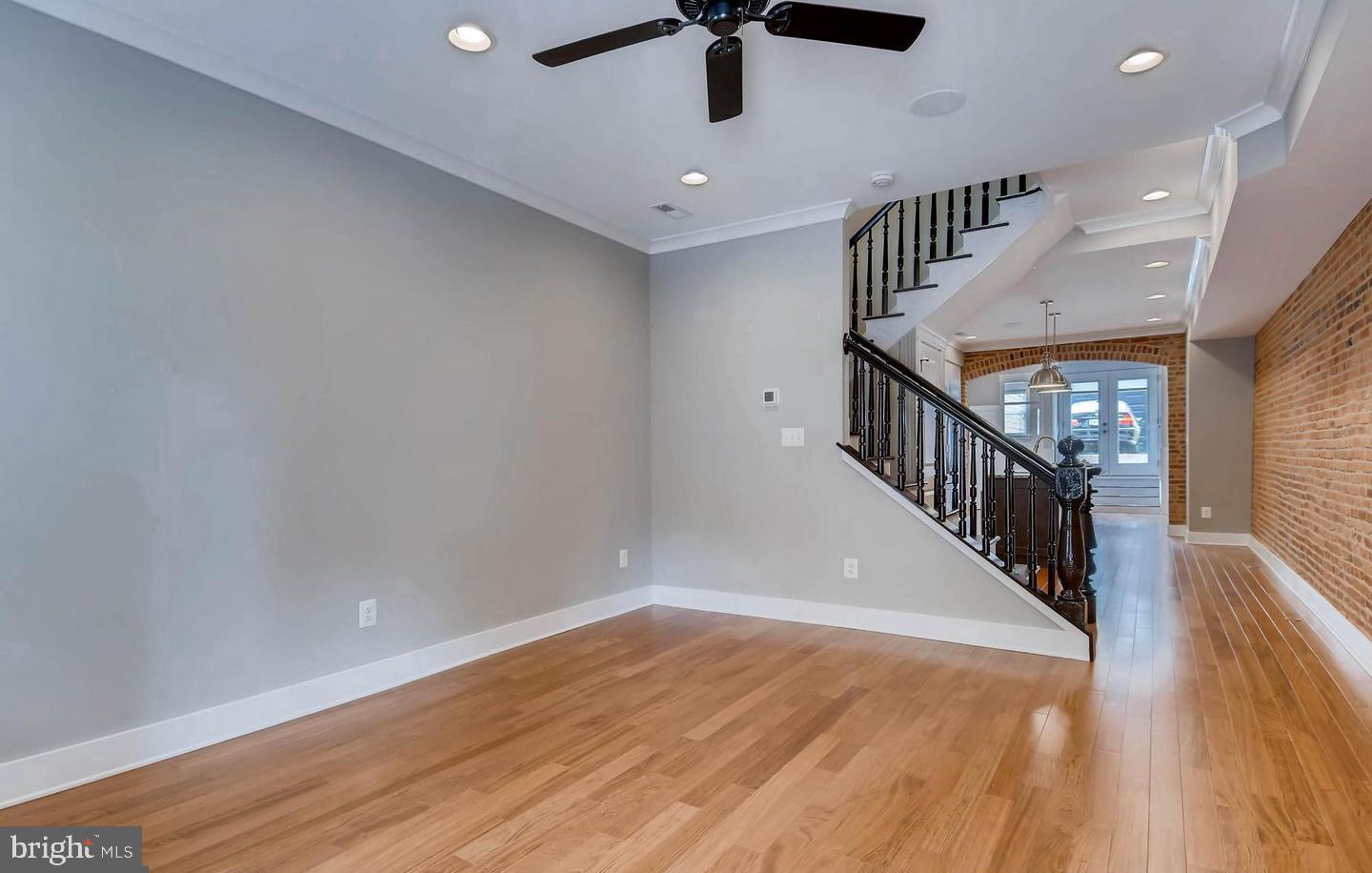 STUNNING THREE-STORY CUSTOM CHAP RENOVATION LOCATED IN THE HEART OF BUTCHERS HILL WITH OVERSIZED DETACHED GARAGE PARKING AND OFF STREET PARKING PAD. 2800+ SQ FT. GLISTENING HARDWOODS CASCADE THROUGHOUT. ENJOY CUSTOM WHITE CABINETRY, UPGRADED TRIM, IMPORTED TILE, QUARTZ COUNTERTOPS, FRAMELESS GLASS SHOWERS, HIGH END SS APPLIANCE PACKAGE WITH WOLF RANGE IN DESIGNER CHEF'S KITCHEN WITH GIGANTIC ISLAND. LOADS OF NATURAL LIGHT. HIGH CEILINGS. TONS OF STORAGE. WALK-IN SHOWERS. CUSTOM BLINDS. EXPOSED BRICK. SPACIOUS 5 BEDROOMS WITH 4.5 BATHROOMS. FULL WET BAR. EXPANSIVE ROOF DECK WITH INCREDIBLE CITY VIEWS - GREAT FOR ENTERTAINING. CLOSE PROXIMITY TO RETAIL SHOPPING, LOCAL DINING, PATTERSON PARK, INNER HABOR AND ALL MAJOR HIGHWAYS.