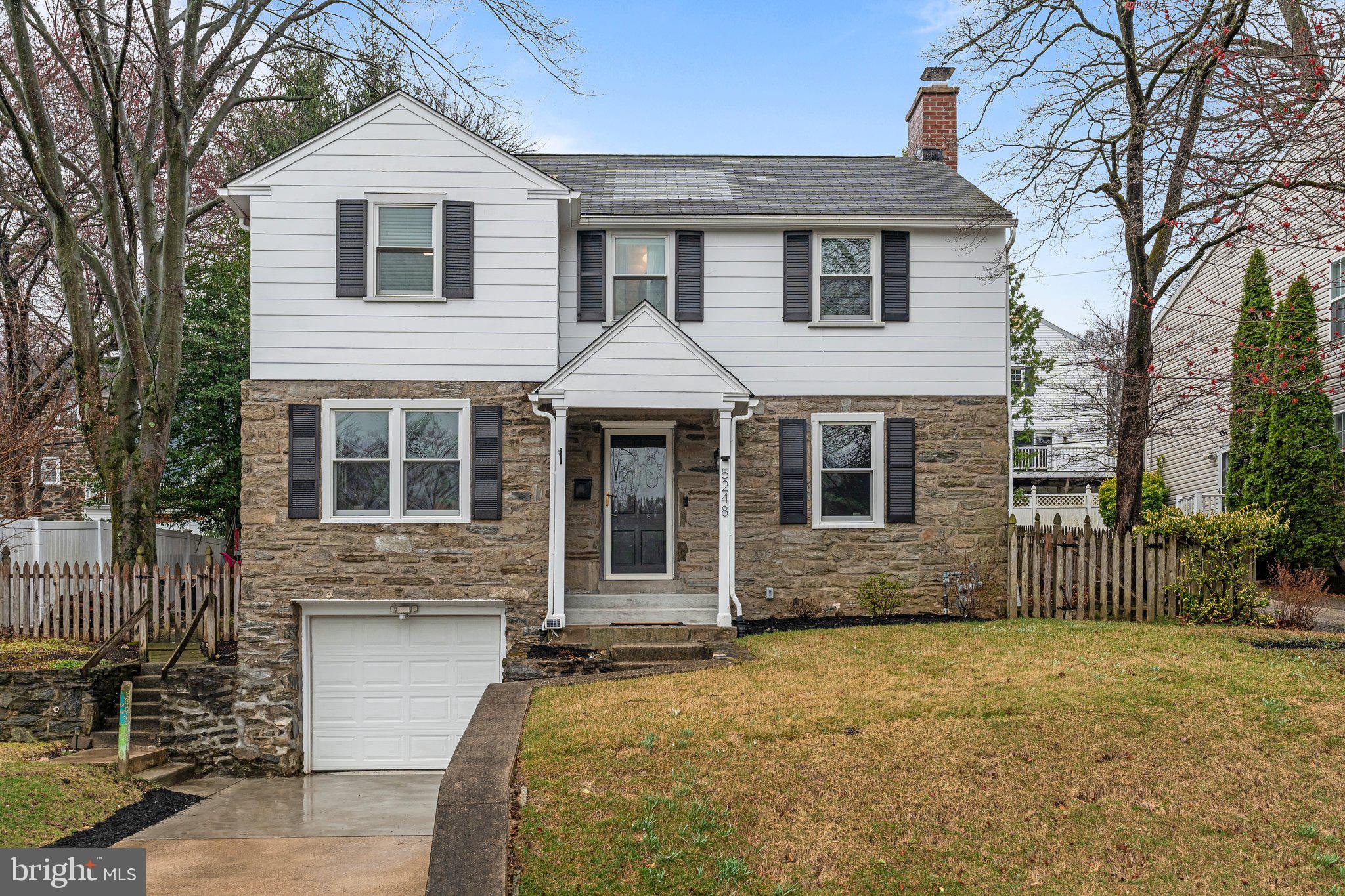 Welcome to 5248 Reservation Rd, a beautifully maintained 4-bedroom, 2.5-bath colonial in the desirable Pilgrim Gardens neighborhood of Drexel Hill. This charming home blends classic character with modern updates, creating a warm and inviting space for comfortable living. Natural light fills the spacious interior, where the great room and formal living room—featuring a cozy fireplace—offer the perfect setting for relaxing or entertaining. The updated kitchen, complete with a wet bar, flows seamlessly into the dining room. A convenient first-floor powder room adds to the thoughtful layout. Upstairs, the primary suite is a private retreat with a fully renovated ensuite bath, while three additional bedrooms provide plenty of space for family or guests. An attached garage offers direct access to a partially refinished basement, perfect for storage or additional living space. Outside, the fenced-in backyard is a private haven for outdoor enjoyment. With walkable access to Pilgrim Gardens Shopping Center, Aronimink Swim Club, Pilgrim Park, and Darby Creek Trail, plus easy commuting via Route 476, public transit, and proximity to Philadelphia International Airport (20 min) and Center City (30 min), this home is truly a gem in a prime location.
