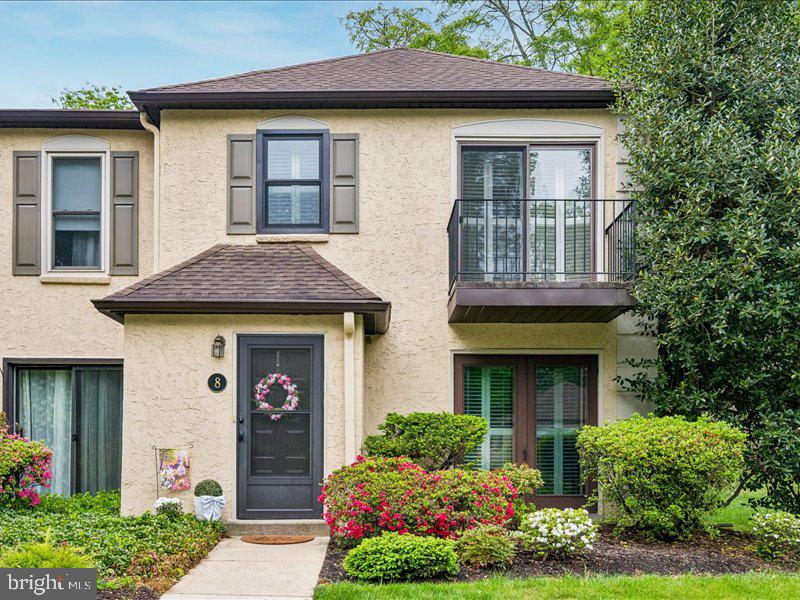 The best of Radnor Township can be found in this beautifully updated  two-story end unit townhome located in the highly sought-after Millridge community in Bryn Mawr; This 2-bedroom, 2-bath residence offers an exceptional blend of comfort, style, and low-maintenance living, with significant investment in high-quality renovations throughout. Step inside to a bright, inviting floor plan featuring a spacious living and dining area with new engineered hardwood flooring, a stunning gas fireplace, and elegant plantation shutters. Sliding glass doors open to a charming flagstone patio—perfect for relaxing or entertaining. The fully renovated kitchen (2024) is a true highlight, showcasing Corian countertops, updated cabinetry, and modern finishes. Both bathrooms have been tastefully renovated (2023) with clean, timeless design. The primary suite offers a peaceful retreat with a private bath, while the second bedroom provides flexibility for guests, a home office, or additional living space. An attic space provides ample storage, adding to the home’s everyday convenience. Recent upgrades include new windows, new sliding doors, and a new heater (2023), offering added comfort and energy efficiency. Residents of Millridge enjoy access to the beautifully appointed Manor House, available for social events, along with guest suites for overnight visitors. The community also features a heated swimming pool and a fully equipped pool house, offering resort-style amenities right at your doorstep. Enjoy the beautifully maintained grounds of Millridge along with its prime Main Line location—just minutes to shopping, dining, and major roadways. A rare opportunity to own a thoughtfully updated home in one of Bryn Mawr’s most desirable communities.