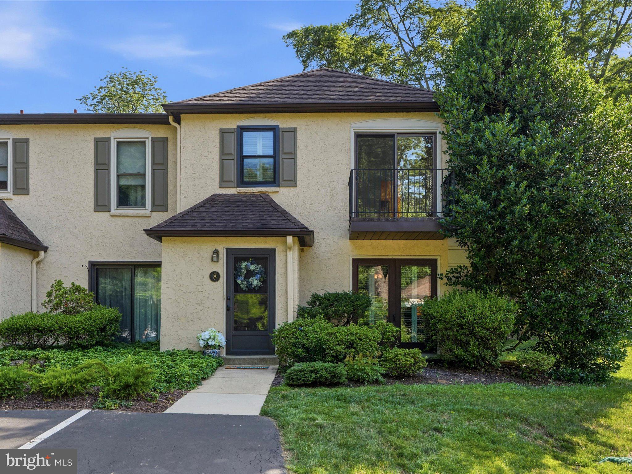 Welcome to Main Line luxury at its absolute finest! Nestled within Bryn Mawr’s highly coveted Millridge community, this stunning, fully updated end-unit townhome offers the pinnacle of sophisticated, low-maintenance living in top-rated Radnor Township. Every corner of this bright and spacious 2-bedroom, 2.5-bathroom residence reflects a meticulous investment in high-quality, professional renovations. Step inside to an inviting open-concept living and dining area boasting premium engineered hardwood flooring and elegant custom plantation shutters. The seamless layout flows beautifully into a cozy family room and a spectacular, gourmet eat-in kitchen reimagined in 2024 with sleek Corian countertops, updated cabinetry, and high-end finishes. From the kitchen, large sliding glass doors transition effortlessly to a gorgeous, private flagstone patio. Surrounded by lush, beautifully maintained grounds, this peaceful outdoor oasis is perfect for relaxing, morning coffee, or al fresco entertaining. Upstairs, the primary suite serves as a peaceful retreat featuring a timeless, tastefully renovated private bath (2023). The second flexible bedroom is ideal for overnight guests or a dedicated home office, complemented by a spacious attic that provides abundant storage. Enjoy total peace of mind and maximum energy efficiency thanks to recent capital upgrades, including a brand-new heating system, updated windows, and new sliding doors (all completed in 2023). As a resident of Millridge, you will enjoy premium resort-style amenities right at your doorstep, featuring exclusive access to the historic Manor House for social events, private guest suites for your overnight visitors, and a heated swimming pool with a fully equipped pool house. Located just minutes from world-class Main Line shopping, elite dining, and major commuter routes, this rare, turn-key property is an incredible opportunity to own a thoughtfully upgraded home in one of Bryn Mawr’s most desirable communities.