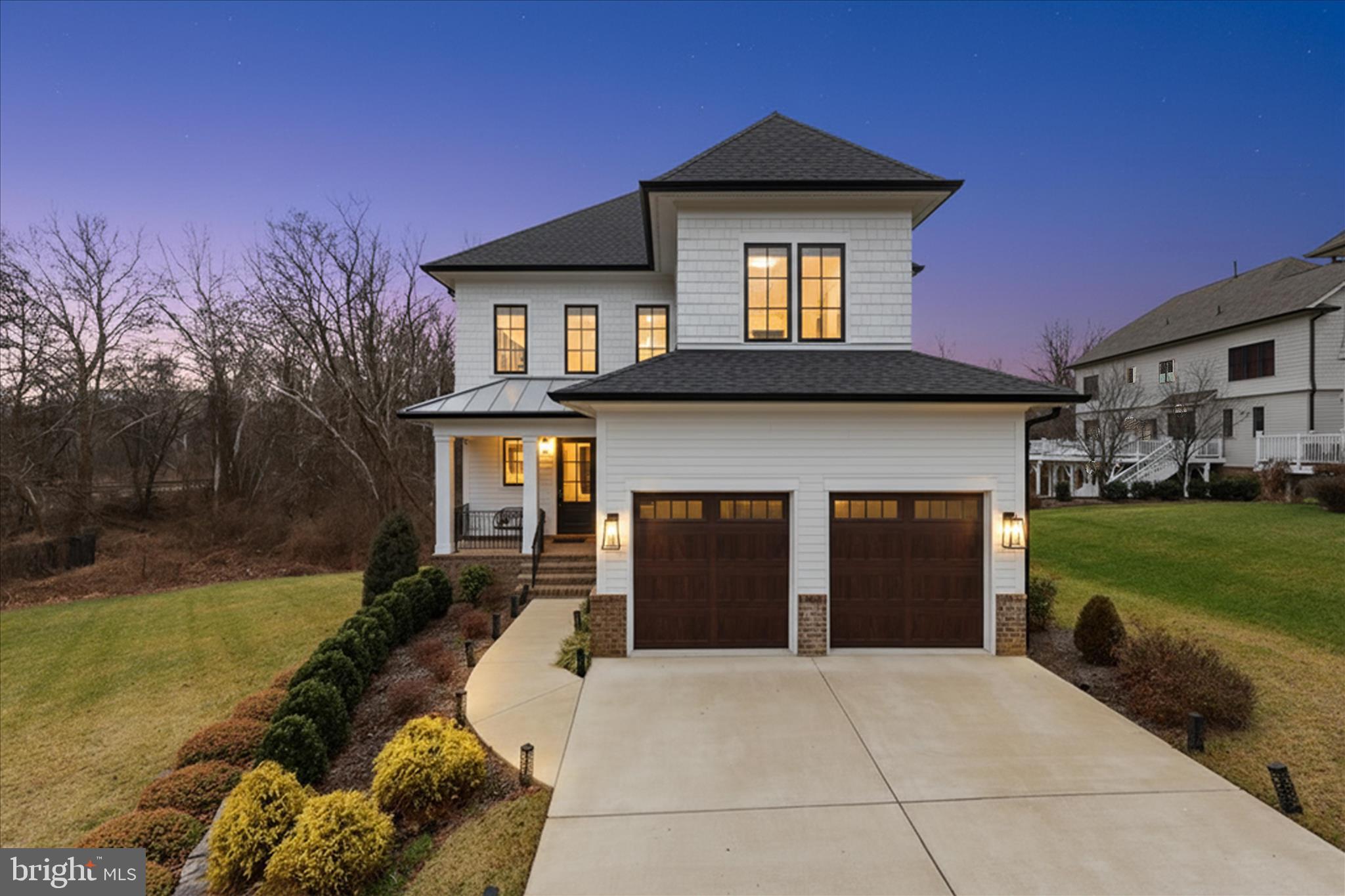 *****Offer deadline Monday 1/26 at 5:00 PM.*****Welcome to this very rare newer home in Burke, offering refined design, modern comfort, and exceptional craftsmanship. Inside, 9’ ceilings, an elegant 8’ glass-paneled entry door, STC-rated casement windows, abundant natural light, and hand-finished wide-plank wood floors create a bright and inviting atmosphere throughout the main level. The thoughtfully designed kitchen serves as the heart of the home, ideal for both everyday living and entertaining, featuring marble-patterned quartz countertops, a generous center island with oversized pendant lighting, a chic brass-tone statement hood, a convenient pot filler, and premium stainless-steel appliances including a 36” Thermador® gas cooktop, GE Monogram® Advantium and convection ovens, and a Bosch® French-door refrigerator with beverage center. Designer lighting and wall sconces add warmth and sophistication throughout. Living spaces include a formal dining room highlighted by a statement chandelier, a bay-window breakfast area overlooking a natural setting, and a spacious family room with recessed lighting, a raised-hearth gas fireplace with custom honed granite surround, and access to a private balcony. The main level also includes a private home office or study, a stylish powder room, and a functional mudroom. Upstairs, hardwood floors continue into the primary suite offering a sitting area, crown molding, recessed lighting, two walk-in closets with custom built-ins, and a spa-inspired bath with dual quartz vanities, a freestanding soaking tub, and a frameless glass-enclosed shower with overhead and handheld sprays. Three additional well-proportioned bedrooms, updated baths, a laundry room with cabinetry, built-ins, and a deep sink, and ample storage complete the upper level. The expansive walk-out lower level features premium carpeting, recessed lighting, built-in contemporary cabinetry, and flexible space for recreation, fitness, or media use, along with a fifth bedroom and a full bath ideal for guests. Completing the home are the striking HardiPlank® shake and lap exterior, professionally landscaped grounds with underground irrigation, and a 2-car garage with insulated wood-toned doors. Conveniently located near I-95, I-395, the Capital Beltway, and Fairfax County Parkway, with easy access to the Burke Centre and Rolling Road VRE stations, bus routes, shopping, dining, and nearby Burke Lake Park and Lake Braddock, this exceptional home offers luxury, comfort, and convenience and is truly a must-see.