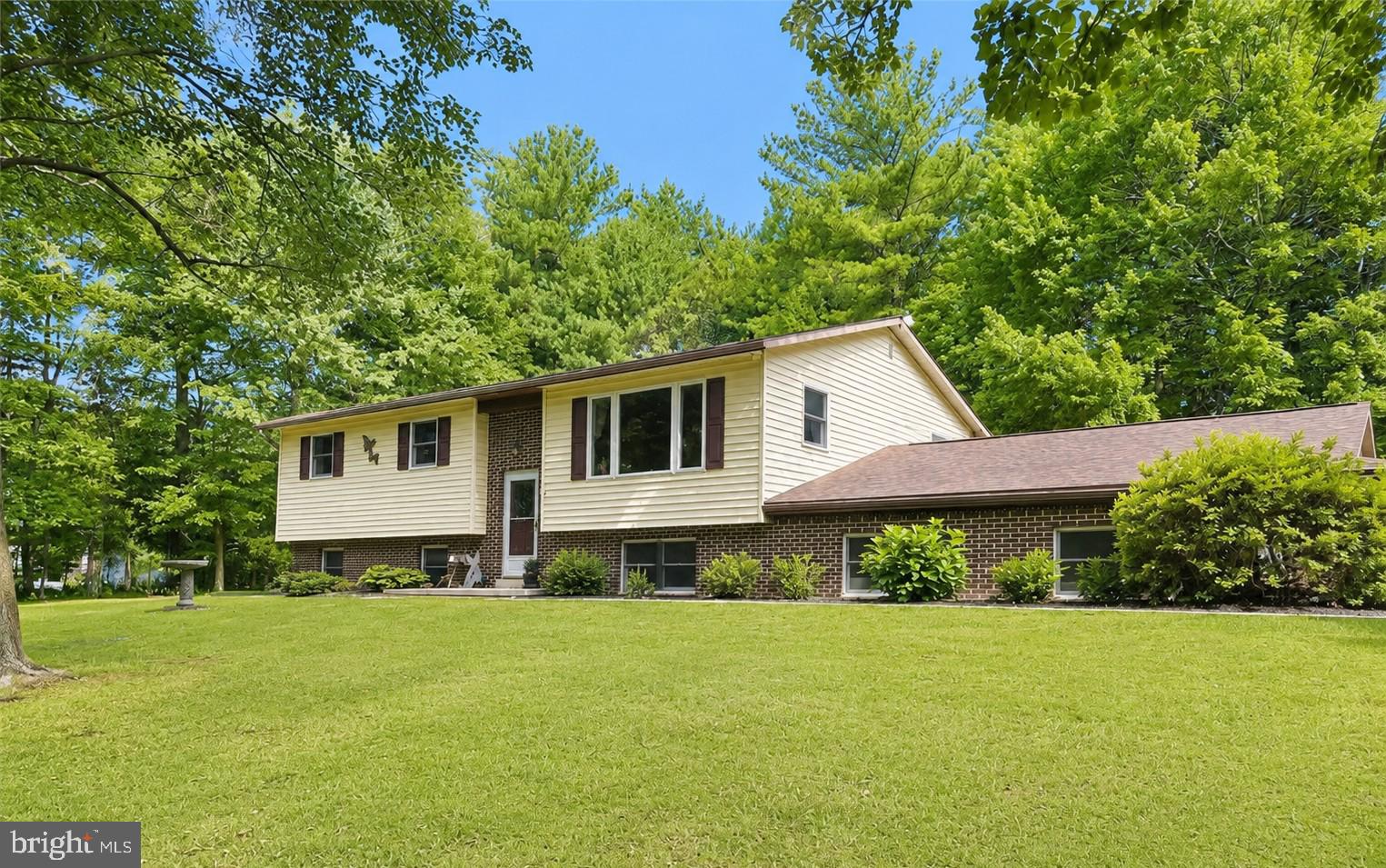 This spacious, well-built, and impeccably maintained 4-bedroom, 1.5-bath home is tucked away in a quiet, peaceful setting in the Lehighton area, just 30 minutes from the Lehigh Valley. Offering a flexible floor plan with more than 2,500 square feet of finished living space on two levels, this home provides plenty of room to live, relax, and entertain. The main level features a spacious living room, while the lower level offers a large family/recreation room complete with a media area—perfect for movie nights, hobbies, or gatherings. Step outside from the kitchen and dining area onto the massive deck, ideal for morning coffee, evening relaxation, or outdoor entertaining. An oversized attached two-car garage and an additional storage shed provide ample space for vehicles, tools, and equipment. Situated on just over an acre, the property is surrounded by wooded borders and beautifully maintained naturalized landscaping, creating a private, serene setting. Major recent improvements include a NEW central air system (2026), NEW roof (2025), NEW front window (2025), and NEW hot water heater (2025). Enjoy the peace and privacy of country living while remaining just minutes from Routes 209, 248, 895, and the PA Turnpike, as well as shopping, dining, and popular outdoor recreation. A rare opportunity to enjoy both privacy and convenience—schedule your showing today!