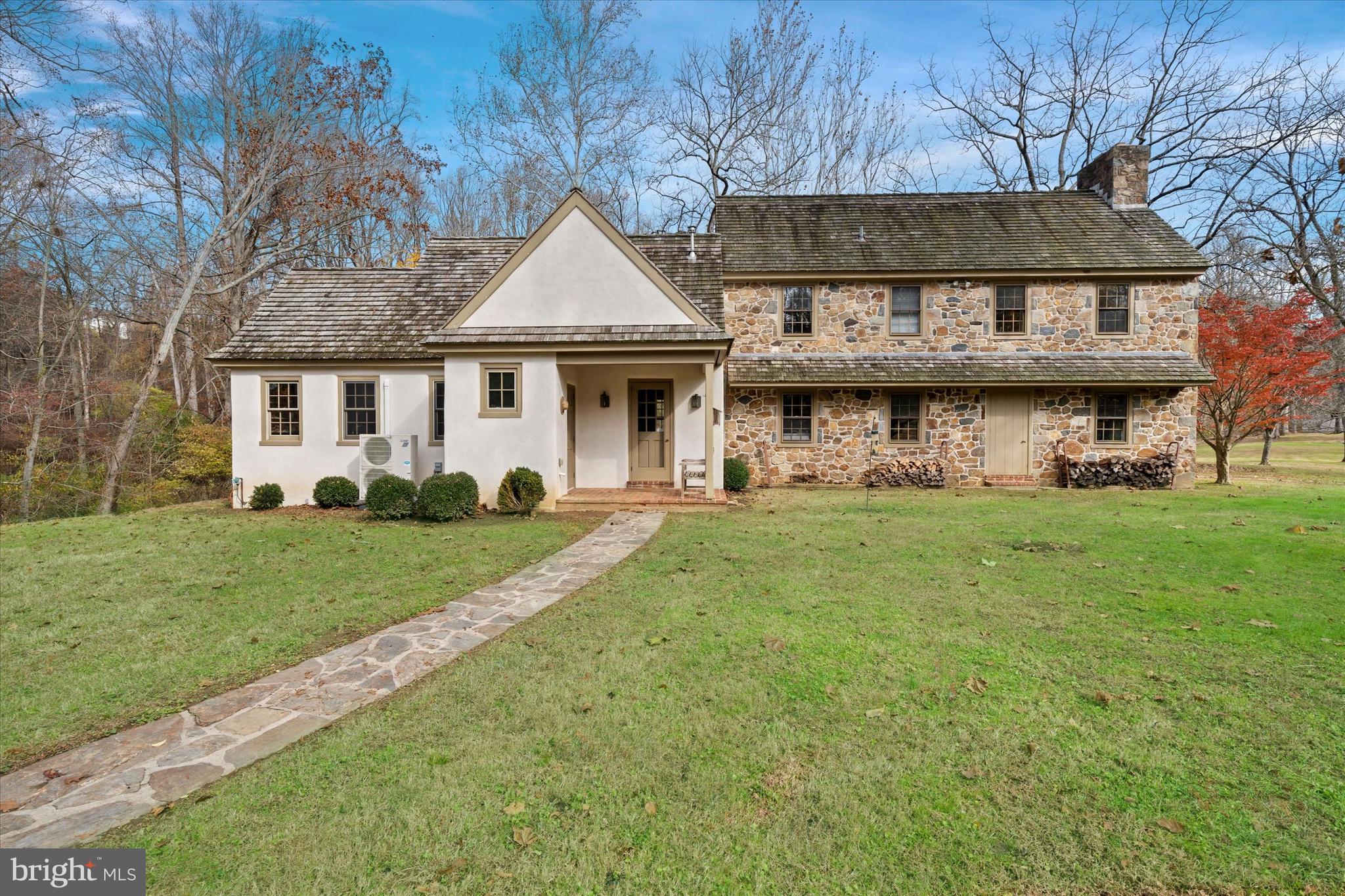 Follow the long tree lined drive to this wonderful property.  975 Brintons Bridge Rd is rare find on this coveted road.  Coming up to the property you will appreciate the lay of the land and the privacy that this property affords.  Enter the home that is filled with charm and details such as brick flooring, random width hardwoods, deep windowsills and exposed beams.  The formal Living Room has a fireplace with doors on either side that lead to the back yard.  From there you flow into the formal Dining Room with brick flooring and exposed beams.  On to the kitchen that is an eat in and overlooks the Family Room with fireplace and built ins.  On the other side of the kitchen down a hall is a Mud/Laundry Room with outside access and tons of closet space.  Continuing down the hall, you will find a large Library/Study/Office space that overlooks a stone patio, private backyard and large pond.  A half bath completes the main floor.  There are two staircases to the second floor, a primary bedroom with fireplace and full bath with attached dressing room with multiple closets that has direct access to the second of the three bathrooms, two more bedrooms, one with a fireplace and the third full bath.  The main house is equipped with (3) ductless, mini A/C splits on main level.  Outside, a rear patio and a composite deck that overlooks a large aeriated pond.  There are a number of buildings on the property including a 3-car detached garage with its own attached cottage.  The cottage is the perfect space for a studio, quiet space, man-cave or guest quarters and is equipped with central A/C.  It has a full bath, a bedroom and large living room.  Down the driveway, on the other side of the pond, there is a storage barn with 4 concrete bays, electric, water, connected office/storage/filing room.  For the pets in the family there are kennels, a 3-stall barn with covered protection on either side, 2 pastures and a smaller fenced paddock.  This property is convenient to Chadds Ford, West Chester, Wilmington, fabulous restaurants and amenities.