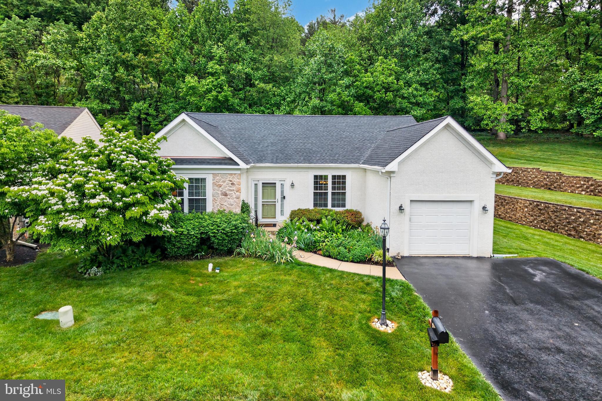 Here are the key deets about this awesome single family  55+ home:
Location, Location, Location! It's in the popular Downing Forge community in Downingtown, PA. Super convenient—just off the Route 30 bypass and close to all the shopping in Downingtown and Exton.
Amenities Nearby: You can literally walk to the community clubhouse, pool, and the tennis/pickleball courts. Get active!
Sweet Curb Appeal: Private lot with a double driveway leading to a one-car attached garage.
Big Bonus: It comes with a whole house generator! No need to worry about power outages.
One-Floor Living: Everything you need is on the main level—perfect for easy living.
Open and Airy: It has an open-concept layout with gorgeous hardwood floors throughout.
Kitchen Goals: The kitchen is the heart of the home, expanded and updated with beautiful cabinets, granite countertops, stainless steel appliances, and a sweet eating area with built-ins.
Outdoor Chill Zone: There's a slider off the kitchen leading to a private deck, patio, and backyard—great for relaxing.
Bedrooms: It features a second bedroom that can totally work as a den or guest room (TV is included!). Plus, the Primary Bedroom Suite is spacious with a walk-in closet (with built-ins!) and an updated Primary bathroom with a walk-in tiled shower.
Full Hall Bath: Right near the second bedroom.
Current owner has replaced the roof and all the windows within their ownership. 
Basement Potential: There's a semi-finished basement with some cabinets, an island, and a sink (the previous owner was a wine maker!). You could easily finish it for more living space or keep it as storage.
Community Perks: Club house, beautiful pool, tennis courts, Bocce court , exercise room, and Hot Tub included in the monthly HOA fee for all your active adults activities. 
DON’T WAIT ON THIS ONE!!!!