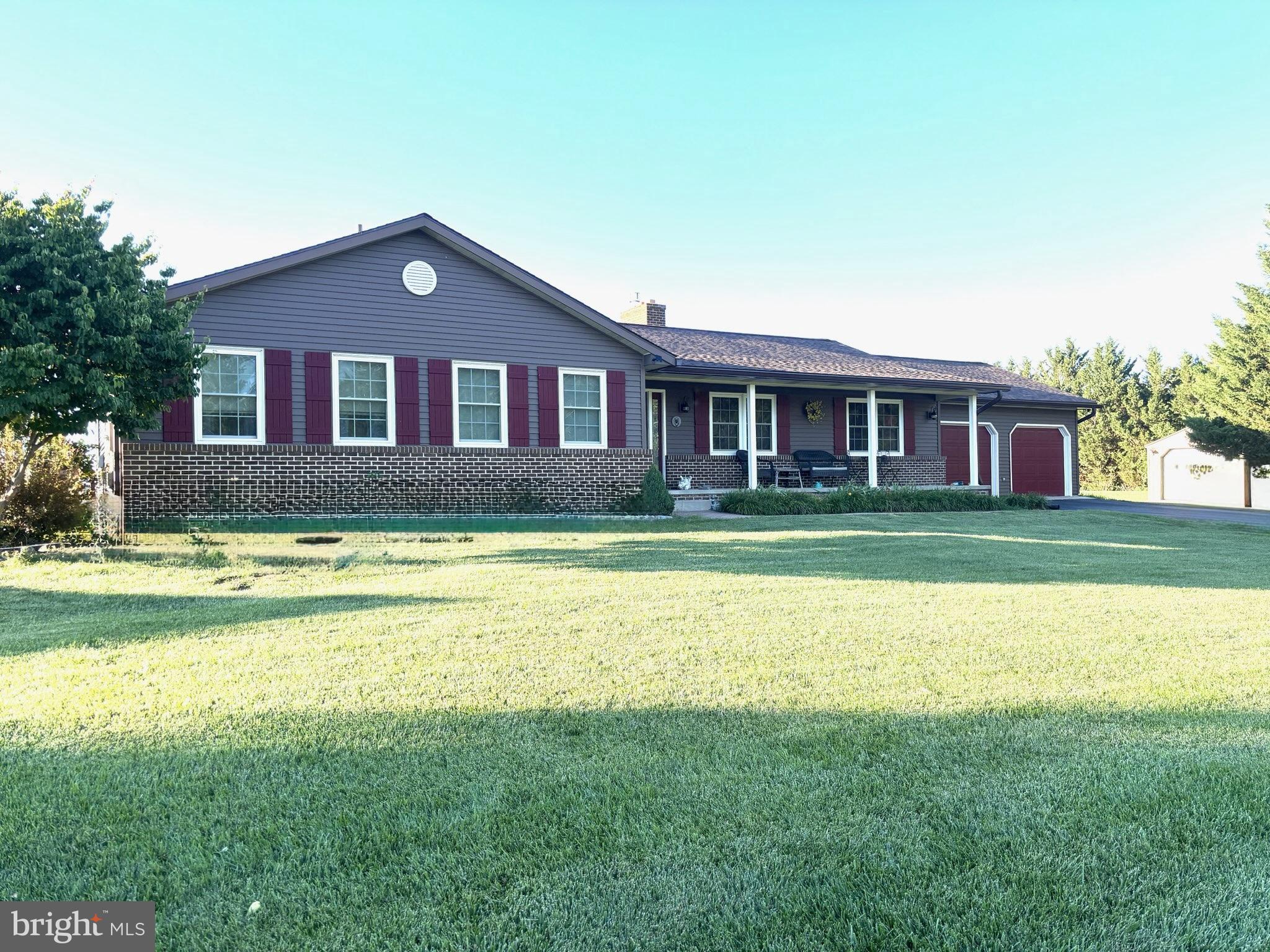 Enjoy peaceful country living with breathtaking mountain views from this beautifully maintained 3-bedroom, 2.5-bath ranch situated on nearly 2 private acres in the Walkersville countryside. Backing to picturesque farmland and mountain views, you'll enjoy the privacy and scenic beauty of the surrounding landscape.

Thoughtfully updated throughout, this home features a brand-new roof, beautiful hardwood floors, an updated kitchen with granite countertops, tile backsplash, newer appliances, and a new luxury vinyl kitchen floor. Most windows have been replaced, along with updated interior light fixtures, adding to the home's move-in-ready appeal.

The spacious family room is highlighted by a stunning floor-to-ceiling stone fireplace, creating a warm and inviting gathering space. Just beyond, the light-filled sunroom offers panoramic views of the surrounding farmland and mountains and features a Hot Spring saltwater hot tub, making it the perfect place to relax, unwind, or entertain while taking in the incredible scenery.

Outside, the nearly two-acre property offers exceptional versatility with an oversized attached two-car garage, a detached 12' x 24' garage/workshop, and an additional 12' x 16' storage shed. A portion of the backyard is fenced, providing a great space for pets while maintaining plenty of open yard to enjoy.

Additional updates include brand-new gutters, approximately six-year-old siding, replacement windows (excluding the basement), updated interior light fixtures, and a septic system pumped in 2026. The home is also equipped with a water softener and UV water purification system.

If you've been searching for one-level living with spectacular views, privacy, multiple garages and outbuildings, and room to enjoy the outdoors, this exceptional property is one you won't want to miss. Schedule your showing today!