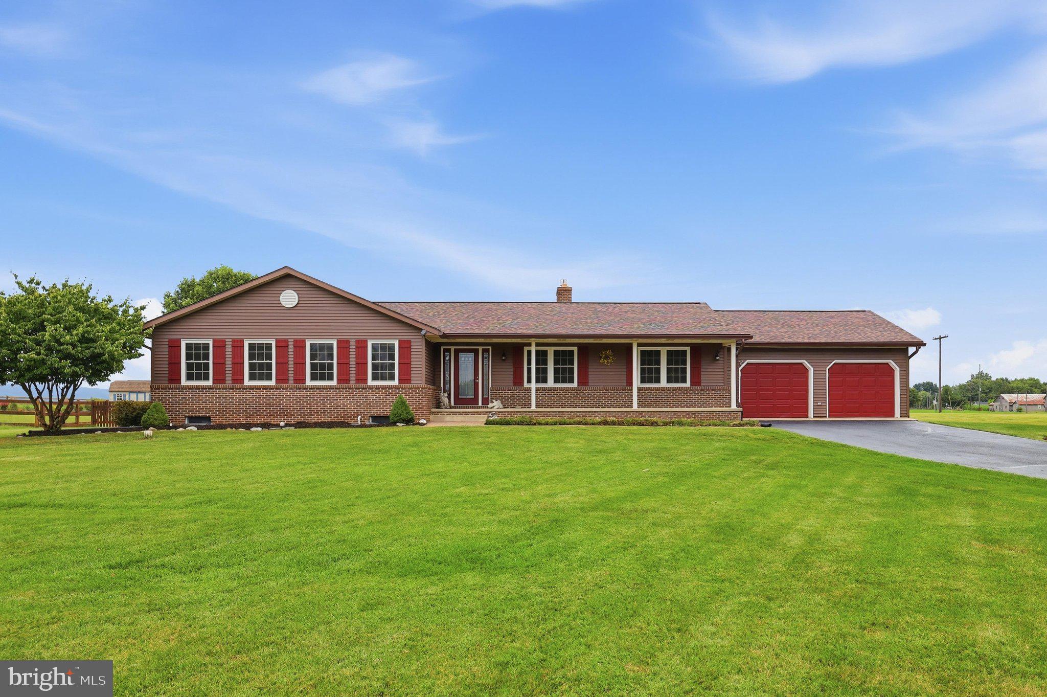 Enjoy peaceful country living with breathtaking mountain views from this beautifully maintained 3-bedroom, 2.5-bath ranch situated on nearly 2 private acres in the Walkersville countryside. Backing to picturesque farmland and mountain views, you'll enjoy the privacy and scenic beauty of the surrounding landscape.

Thoughtfully updated throughout, this home features a brand-new roof, beautiful hardwood floors, an updated kitchen with granite countertops, tile backsplash, newer appliances, and a luxury vinyl kitchen floor. Most windows have been replaced, along with updated interior light fixtures, adding to the home's move-in-ready appeal.

The spacious family room is highlighted by a stunning floor-to-ceiling stone fireplace, creating a warm and inviting gathering space. Just beyond, the light-filled sunroom offers panoramic views of the surrounding farmland and mountains and features a Hot Spring saltwater hot tub, making it the perfect place to relax, unwind, or entertain while taking in the incredible scenery.

Outside, the nearly two-acre property offers exceptional versatility with an oversized attached two-car garage, a detached 12' x 24' garage/workshop, and an additional 12' x 16' storage shed. A portion of the backyard is fenced, providing a great space for pets while maintaining plenty of open yard to enjoy.

Additional updates include brand-new gutters, approximately six-year-old siding, replacement windows (excluding the basement), updated interior light fixtures, and a septic system pumped in 2026. The home is also equipped with a water softener and UV water purification system.

If you've been searching for one-level living with spectacular views, privacy, multiple garages and outbuildings, and room to enjoy the outdoors, this exceptional property is one you won't want to miss. Schedule your showing today!