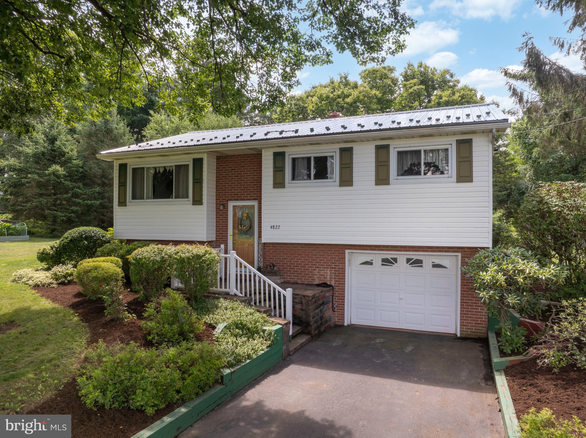 OPEN HOUSE - Sunday, July 12th, 10:00 - 11:30 AM
Welcome to this lovingly maintained, one-owner home nestled in the peaceful community of Penna Furnace, where beautiful rural surroundings create the perfect place to call home. Enjoy picturesque farm field views from the front living room and the privacy of a flat, fenced backyard, ideal for gardening, pets, or outdoor entertaining. This well-cared-for bi-level offers three bedrooms, one full bath, a bright and spacious living room, and an inviting kitchen with Corian countertops overlooking the backyard. The light-filled sunroom addition provides the perfect space to relax and enjoy every season. The lower level features a spacious family room, laundry area, and access to the attached one-car garage. Additional highlights include State College Area School District, central air conditioning, a durable metal roof, a storage shed, and pride of ownership throughout. If you've been searching for the charm of country living with beautiful views and a home that's been exceptionally cared for, this is one you won't want to miss.