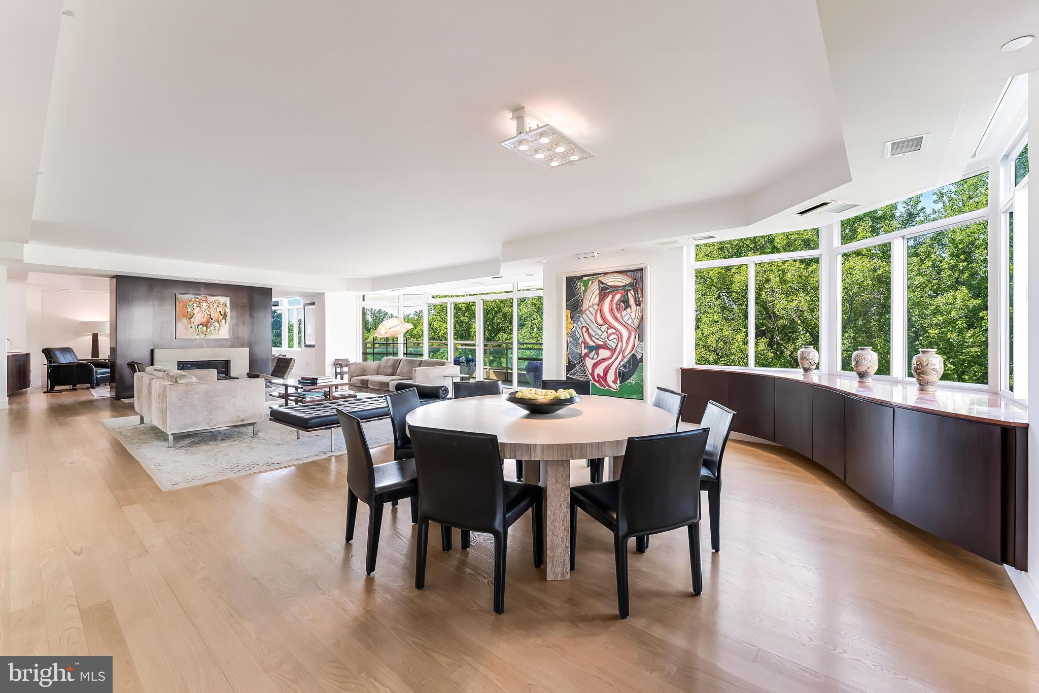 An exclusive and rarely available 4,550 SF fully renovated gallery residence at Parc Somerset, offering sweeping panoramic views, extraordinary natural light, and world class amenities within Friendship Heights’ premier gated community. Masterfully created by combining two residences into one dramatic modern showpiece, this exceptional residence has been thoughtfully reimagined with expansive open spaces designed for sophisticated living and grand scale entertaining.

A gracious gallery style entrance foyer sets the tone with curated museum quality lighting, rich mahogany architectural accents, and a crisp designer palette, creating a striking yet timeless first impression. Elegant hardwood flooring extends throughout the residence. The expansive living room, anchored by a fireplace and custom built-ins, opens through walls of glass to an oversized balcony, seamlessly blending indoor and outdoor living. A gracious dining room and inviting den with a wet bar further enhance the home’s effortless flow for entertaining.

The gourmet chef’s kitchen is appointed with custom contemporary cabinetry, premium appliances, designer lighting, and an oversized center island, and opens to a sunlit breakfast lounge and sitting area designed for both casual gatherings and everyday comfort.

The extraordinary primary suite serves as a private retreat, featuring multiple sitting areas, a private balcony, and an adjoining library or office with access to one of two full bathrooms. A couture inspired dressing room with dual walk-in closets complements the luxurious spa bath, exquisitely finished in marble and travertine and offering a soaking tub and separate glass-enclosed shower.

Two additional en-suite bedrooms, a beautifully appointed powder room, laundry room, and extensive storage complete the residence.

Three garage parking spaces and two private storage rooms convey.

Set amid more than 17 acres of beautifully landscaped grounds, Somerset House offers an unparalleled lifestyle with gated entry, 24-hour security, indoor and outdoor swimming pools, tennis courts, a clubhouse, fitness center, racquetball court, and social lounge. Ideally located moments from Friendship Heights Metro, premier shopping, acclaimed dining, and major medical centers, this is luxury condominium living at its finest.