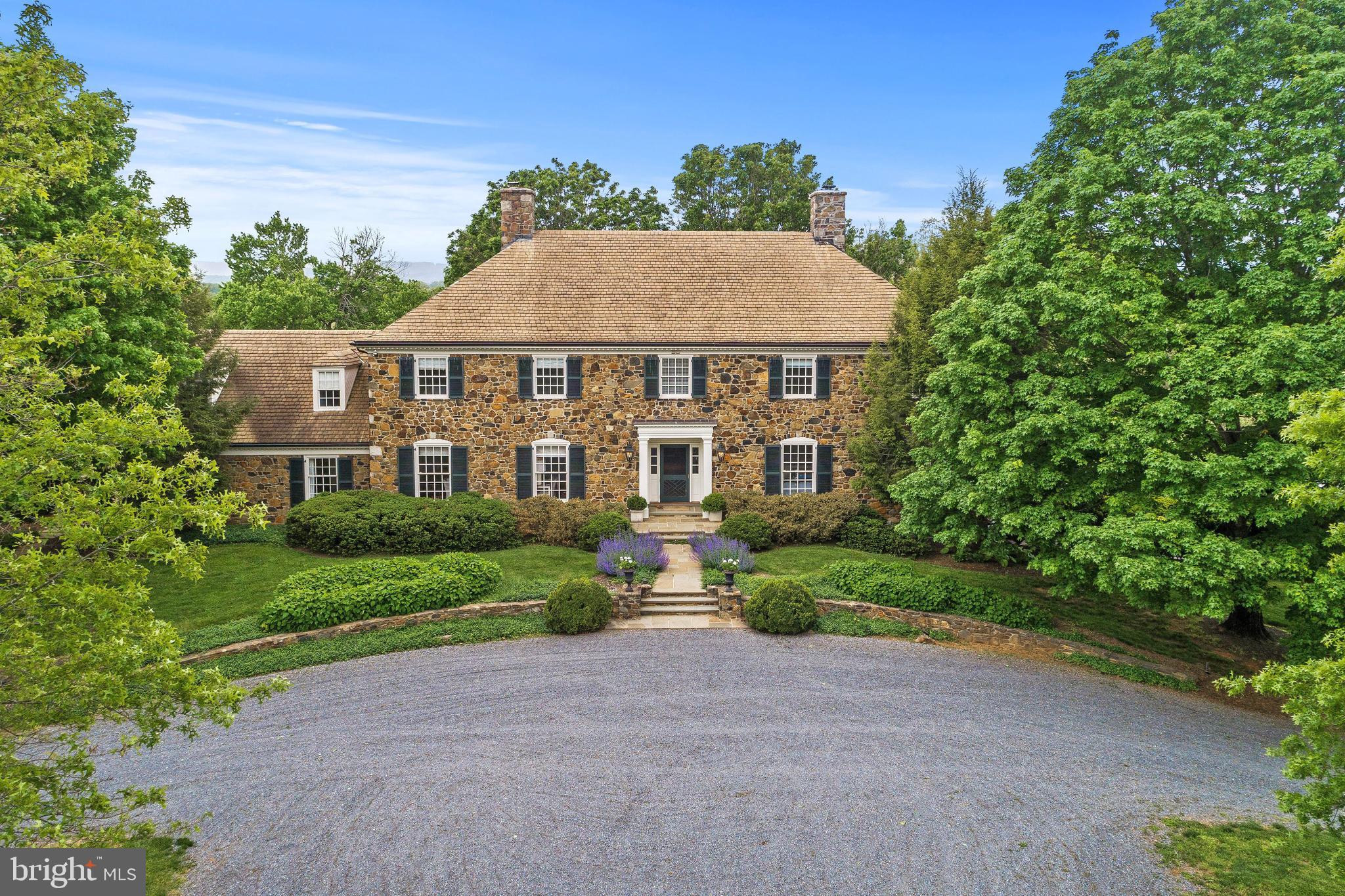 Set on 86.81 gorgeous acres, the panoramic mountain views enjoyed from Oakfield's grounds are extraordinary (and secure thanks to the neighbor's land being in conservation easement). This exceptional property features a fully appointed 5 bedroom, 5 bath, 3 half bath, 3 fireplace manor house with a grand foyer (complete with a discrete elevator),  gourmet kitchen, sumptuous master suite and a cozy pine-paneled den with a wet bar and fireplace. The property includes a 4 stall horse barn with a ring, heated saltwater pool with pergola, and a recently renovated tenant house.
