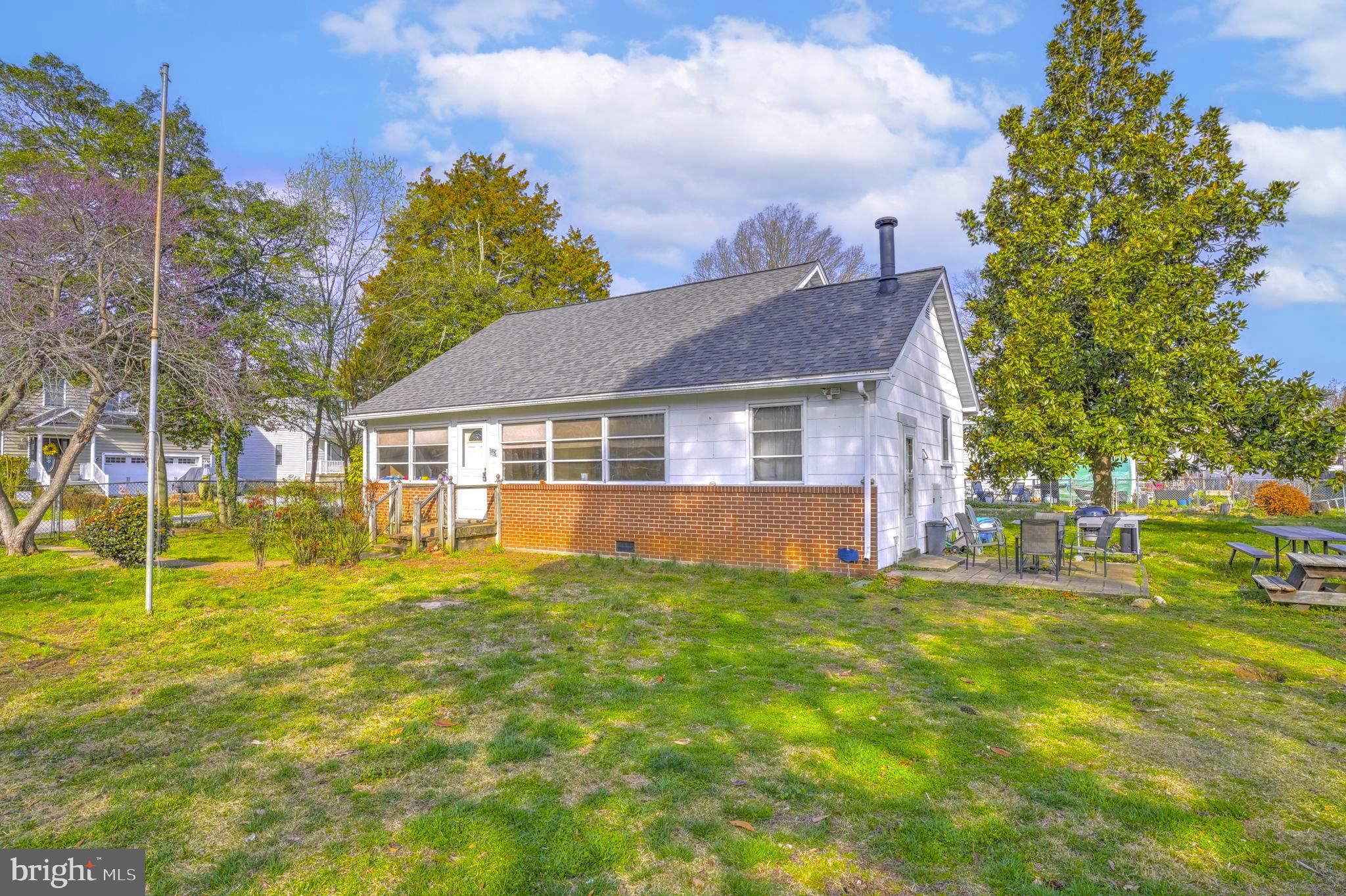 Set on one of the largest parcels in the highly desirable Selby On The Bay community, this property sits on a rare double lot—offering potential space for additional home site,  garage, outbuilding, or future expansion. The home features a kitchen that opens to the living room, a bright enclosed porch for year-round enjoyment, two main-level bedrooms (one without a closet), and a full bath. Upstairs, you’ll find two additional bedrooms and another full bathroom, providing flexible living space. The fully fenced yard includes a spacious shed or “man cave” with electricity—perfect for hobbies or extra storage. Major updates include a roof approximately 2 years old, along with an oil furnace (10 yrs. old), and hot water heater less than a year old. Enjoy the convenience of walking to community amenities such as the beach, clubhouse, boat ramp, playground, and more.