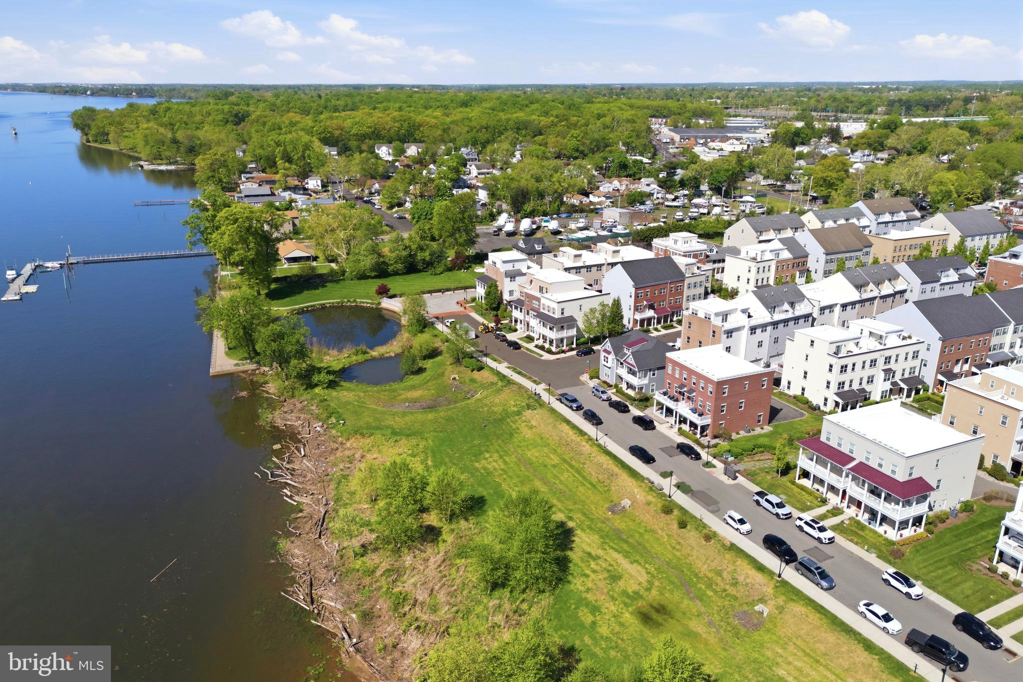 Welcome to one of the most desirable homes in Waterside—an upgraded Annapolis Grand model by original builder Mignatti, and one of only 8 rare side-by-side models.  The sellers opted for all upgrades to provide optimal convenience and affordable luxury. 

Offering approximately 2,310 square feet, this home layout is larger than similar models, offering an expanded breakfast nook with extra cabinetry, a wet bar and beverage fridge.  The premium upgraded kitchen is designed with quartz countertops, island sink, glass pendant lighting, tiled backsplash, a double door pantry, and newer stainless steel appliances: GE Profile Café gas range, matching microwave (2025) and a Bosch dishwasher (2025). The rest of the 2nd floor includes crown molding, recessed lighting, engineered hardwood floors, access to your custom marble tiled powder room, and balcony showcasing the best unobstructed waterfront views in the whole neighborhood! The entire home is filled with natural light thanks to five additional eco-friendly windows to help save energy. 

Follow the new pine wood stairs to the third level hosting three carpeted bedrooms, hall bathroom with tub and laundry area with newer washer (March 2026). The primary suite is located near the front of the home to wake you up with sunrises every morning and includes a spacious walk-in closet and en-suite shower stall bathroom with his and her sinks. 

The ground-level flex space has provided the sellers with many uses throughout the years as a  gym, den, game room, guest room, and currently as an office. Access your oversized 2-car garage, equipped with custom built-in storage shelving, refrigerator and dart board. Guest parking is never an issue with a rear driveway for 2-3 additional vehicles. This exclusive location also offers the benefit of a side yard rarely found in townhome living.

Additional highlights include gas heat with forced hot air, built-in system humidifier, 3-zone Nest thermostats, hardwired sprinkler and fire alarm system and keyless entry.

Location is truly convenient with quick commute routes to Philly, Trenton, or the Jersey Shores via I-95 or the Cornwell Heights regional rail station. And with local favorites such as Waterside Cafe and Broken Goblet Brewing, you don't even have to leave!

Lastly, the sellers are willing to offer mostly all furniture in the home, with valuable items marked negotiable such as the built-in garage Tesla charger or outdoor furniture.  The sellers spared no expense for their enjoyment and are ready to offer the  premium upgrades and prime location for the benefit of the next lucky homeowner!