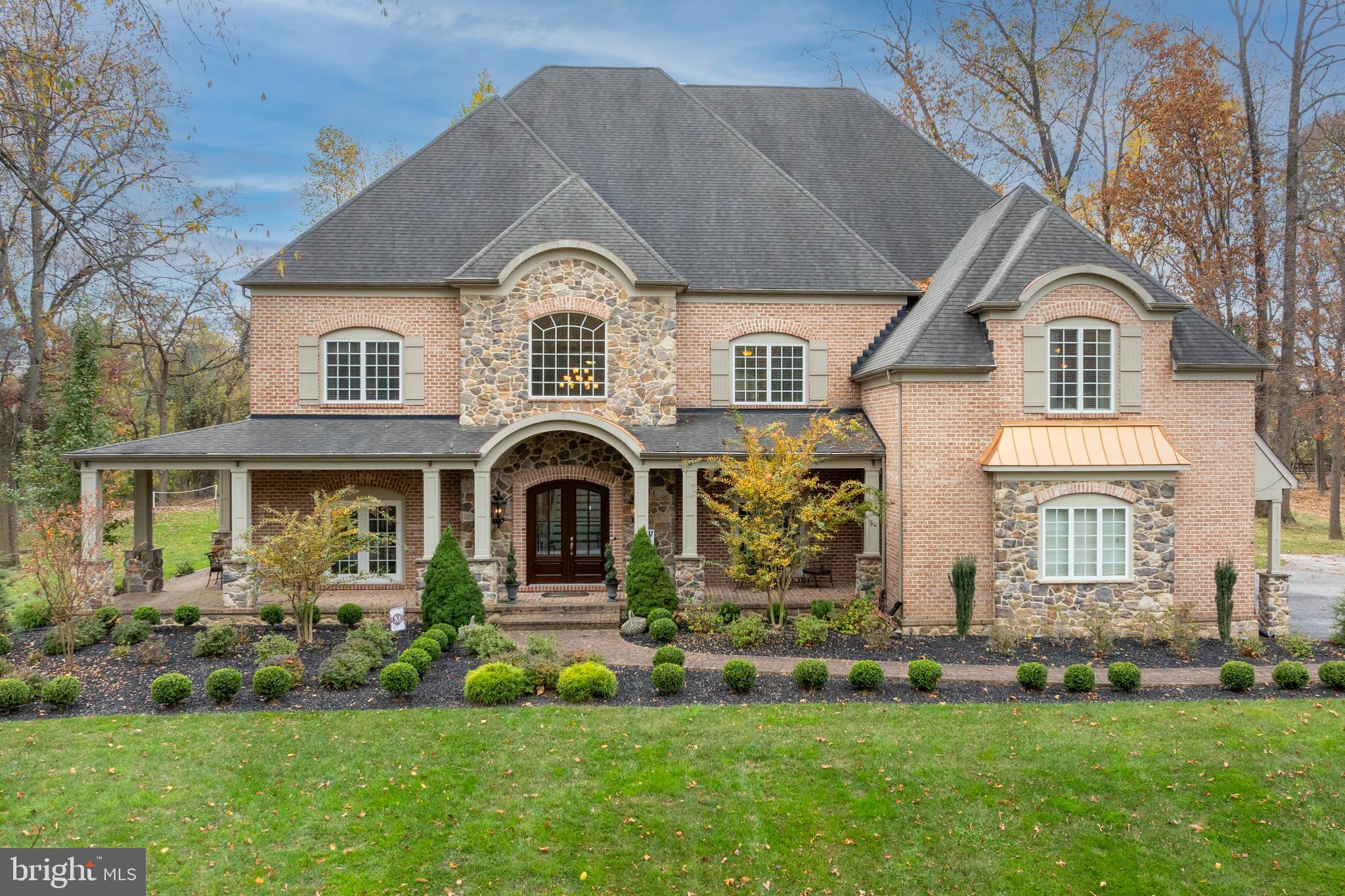 Welcome to this extraordinary home in the prestigious community of Medford. With almost 11,000 square feet of finished space, a property of this size and quality rarely comes to market.  From the moment you cross the threshold you will be awed by the home’s light and space. Welcome guests into your grand 2-story foyer with its soaring staircase and impressive moldings. The well-appointed formal dining room opens from the foyer on the right, while the lovely formal living room is opposite. A luxurious wet bar with custom cabinetry connects the formal dining room to the gourmet kitchen.  The kitchen is a cook’s dream, with its 48” Bertazzoni 6-burner (plus grill) range, Viking Professional refrigerator, beautiful stone countertops, loads of storage, and views to the landscaped rear yard.  Adjacent to the kitchen is one of the home’s two large laundry rooms, this one with access to the 3-car garage – every detail of this plan was considered.  A large eating area is off of the kitchen, with a wall of windows across the back of the house overlooking the stone patio and outdoor living room with fireplace.  The huge yet comfortable double height family room with its built-ins and soaring stone gas fireplace opens to the kitchen, making it a wonderful room for entertaining while preparing meals. The spacious main floor also features a handsome office with built-ins, and a large billiard room with wet bar.  Enjoy your backyard paradise with its huge, landscaped flat yard.  So many outdoor entertaining spaces to enjoy!  Covered porches, open stone patios and an outdoor living room with fireplace and television provide multiple options for entertaining or just enjoying your morning coffee.  When weather sends you inside, there is much more for enjoying family and friends time on the lower level, which is like none you have ever experienced. Treat your guests to a movie or the game in your spectacular movie theater with its Dolby Atmos system and 150” screen. Also on the lower level are a large gym, a HUGE sports room that is currently outfitted for the soccer player in your life but could be used for any type of sport, a guest suite with a large walk-in closet and en suite luxury bath.  The family room is the perfect spot to entertain or sit and relax, and there are numerous storage closets and play areas that complete this incomparable lower level.  At the end of an evening, your primary suite awaits. This luxurious retreat features an enormous bedroom, his and her walk-in closets that are beyond compare, beautiful bathroom with spa tub and shower, his and her sinks.  A coffee/wine bar and direct access to the sun porch with its cozy gas fireplace completes your oasis. Three other huge bedrooms, all with en suite baths and walk-in closets, and a large laundry room are featured on the second level.  Every possible luxury and convenience has been designed into this extraordinary home.  Be sure to watch the video of this superb home!