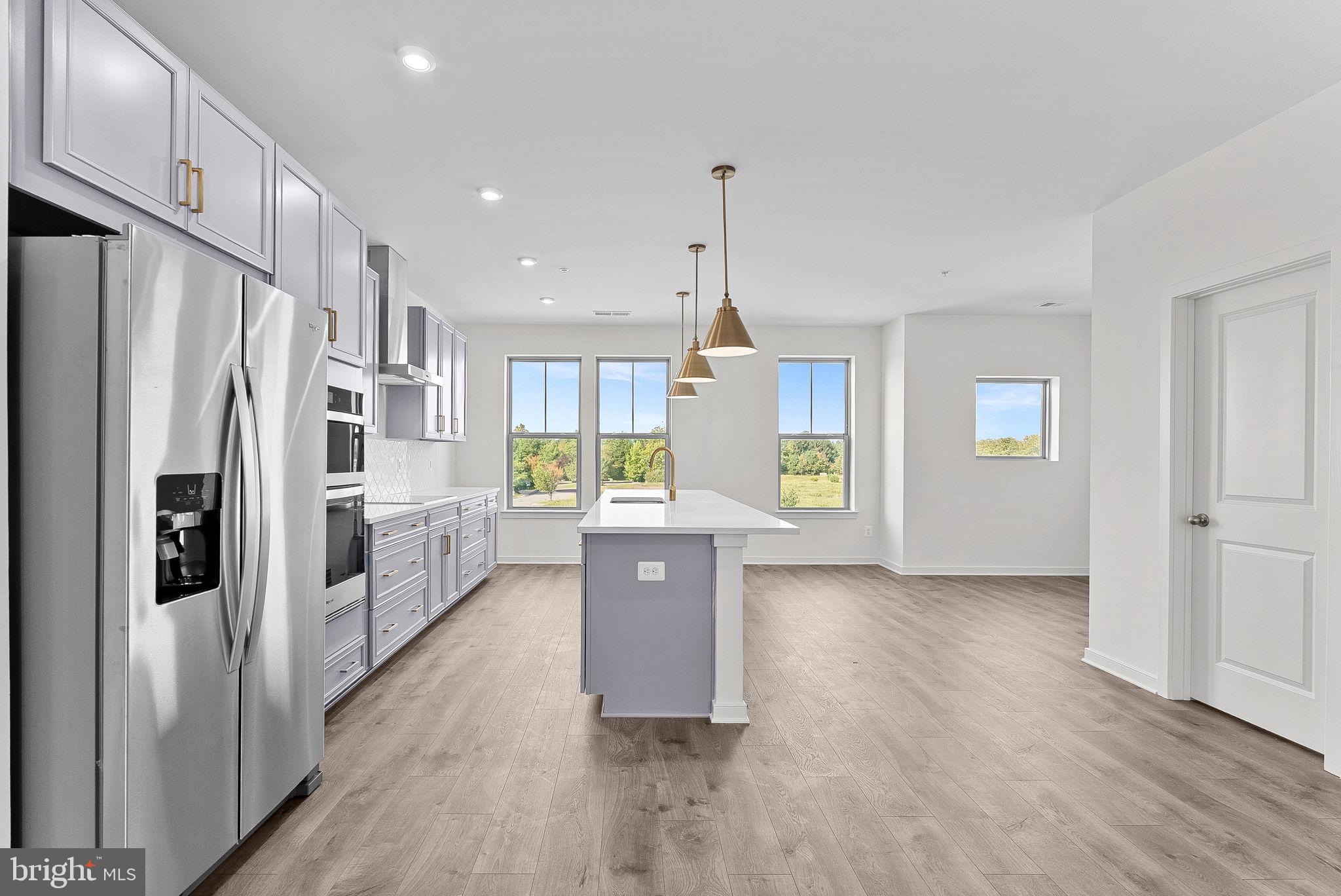 NEW CONSTRUCTION. Special all in price, ready for September move in! Receive up to 3.99% 5/1 ARM [5.94% APR] FHA & VA Rate with Choice Lender on Quick Move-In Homes!* Monthly payments are made easier during Beazer Friends & Family Sales Event until 7/31. Welcome to the Hepburn, a brand- new, upscale stacked townhome in the sought-after Belmont Park community in Ashburn, VA. This 2-level home with a 1-car garage is designed for convenience and style—perfect for those ready to move quickly! Featuring 3 bedrooms and 2.5 baths, this home boasts a modern kitchen with 42” cabinets, LED lighting, quartz countertops, and stainless-steel Whirlpool appliances. A generous kitchen island and covered deck invite connection. The spacious primary suite includes a generous walk-in closet and a luxury bathroom with raised double vanities and a walk-in spa shower. Plus, the garage comes equipped with an EV charger-compatible outlet for future-ready living. Enjoy low- maintenance living with snow removal, lawn care, and exterior upkeep all handled for you—giving you more time to enjoy life, not maintain it. Hometown heroes get $2,500 (restrictions apply; see New Home Counselor for details). Belmont Park offers resort- style amenities including bocce ball, volleyball, playgrounds, community greenspace, and more. Located in Ashburn, you’ll have quick access to major roadways, Dulles Airport, and endless dining and entertainment. Beazer Homes at Belmont Park are designed to live better day to day, with energy efficient construction that lowers monthly utility costs, thoughtful design options that make personalization simple, and Mortgage Choice, where our top lenders help you compare options and save money on your home loan. This high-performance home is built to lower your total cost of homeownership through reduced utility bills, durable materials, and high-quality construction that minimizes long- term maintenance costs. Beazer Homes is proud to be America’s #1 Energy Efficient homebuilder. Our FY25 average gross HERS score of 32 (38 excluding solar) was the lowest of the publicly reported scores among the top 30 U.S. homebuilders by volume identified by Builder Magazine’s Top 100 List (based on 2025 total closings). Get protection against rising energy costs without changing how you live. Every Beazer home is pre-wired for solar, making it easier and more affordable to add a renewable system when you are ready. Photos of similar home. Model Home Hours: Mon–Sun, 11 AM–6 PM. Use 19758 Misty Moss Square Ashburn, VA 20147 for GPS directions. Parking will be next to our Information Center trailer. Please go to the model home listed here first.