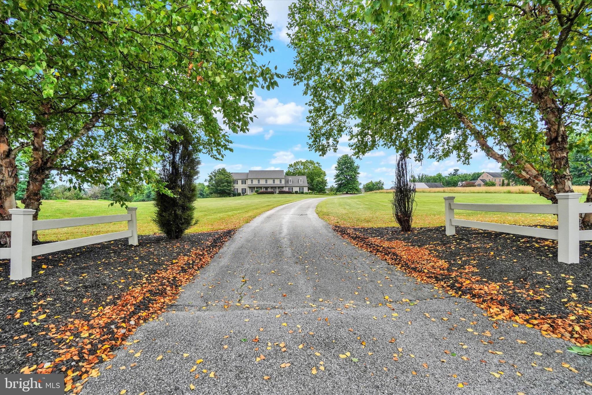 Welcome to this exceptional Stoltzfus-built home, custom built in 2000 and situated on 6.10 beautiful acres in the Central School District. Offering quality craftsmanship, spacious living, and outstanding outdoor amenities, this is a property that truly has it all.  Step inside the impressive two-story foyer featuring hardwood floors and soaring ceilings. The main level offers a formal dining room with hardwood floors, crown molding, and chair rail, a private office, a full bath, and a spacious family room with hardwood floors and a cozy gas fireplace. Dual front and rear staircases add both convenience and character.  The gourmet kitchen is designed for everyday living and entertaining, featuring a center island, farmhouse sink, coffee station, pantry, Sub-Zero refrigerator, gas cooktop, electric oven, and tile flooring. Just off the family room, enjoy the screened porch overlooking the backyard oasis.  Outside, you'll find a 4-foot-deep saltwater pool, a pavilion with electric service, and plenty of room to relax or entertain on the beautifully landscaped property.  Upstairs, the expansive primary suite includes a luxurious bath with a jetted tub. A second-floor laundry room adds everyday convenience.  Additional features include a gas furnace (approximately 3 years old), gas hot water heater, on-site well and septic, with public water and sewer available at the street.  Car enthusiasts, hobbyists, and business owners will appreciate the impressive 40' x 60' Amish-built barn/outbuilding, offering space for approximately 6 to 8 vehicles, equipment, or workshop needs.  A rare opportunity to own a beautifully maintained home with acreage, premium amenities, and an unbeatable setting in the Central School District.